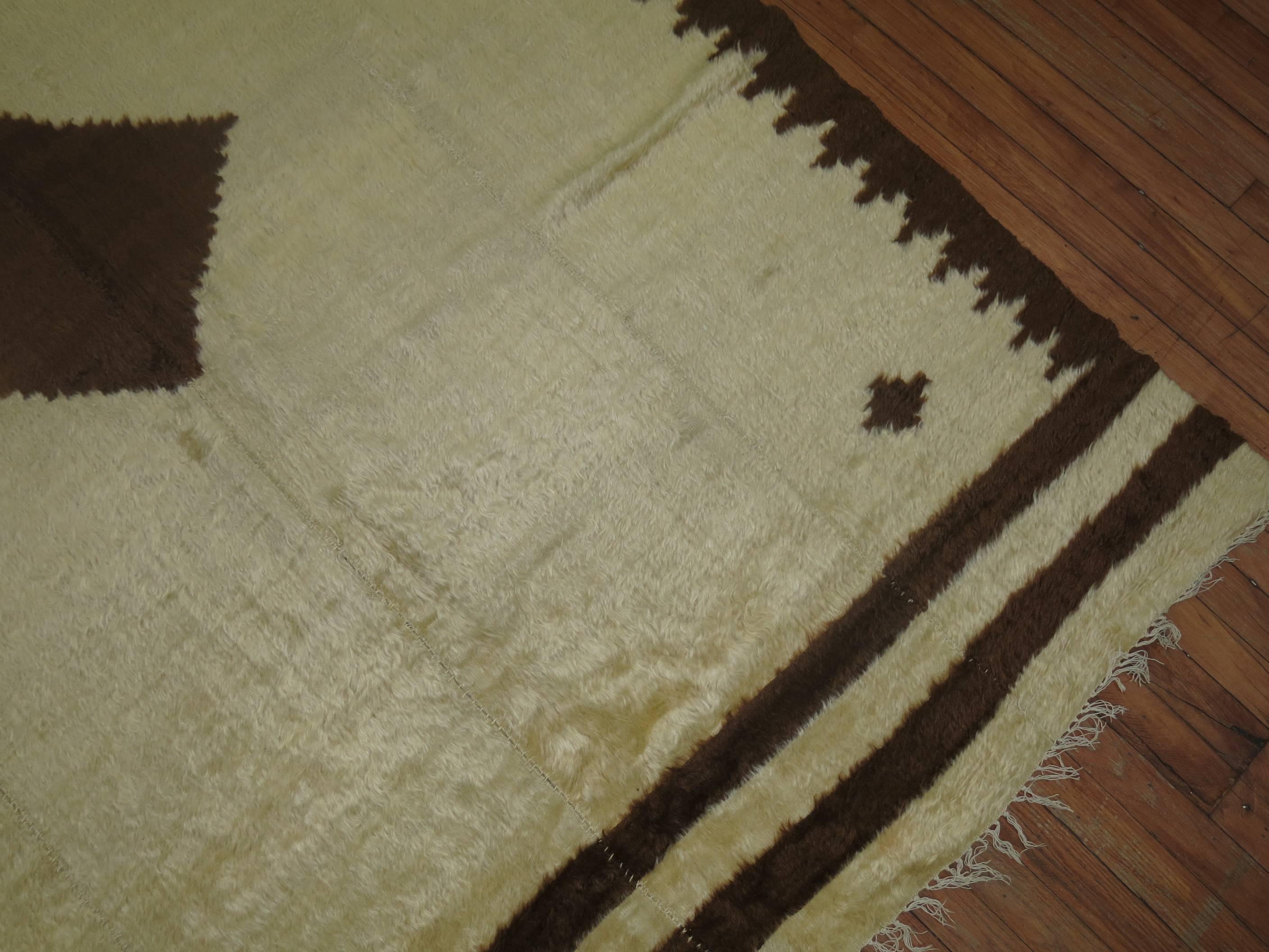 From Eastern Turkey this piece was made with soft Angora goat hair woven in four panels on a narrow loom in ivory and brown. Can be used as a blanket or a floor rug in a low or high traffic area.