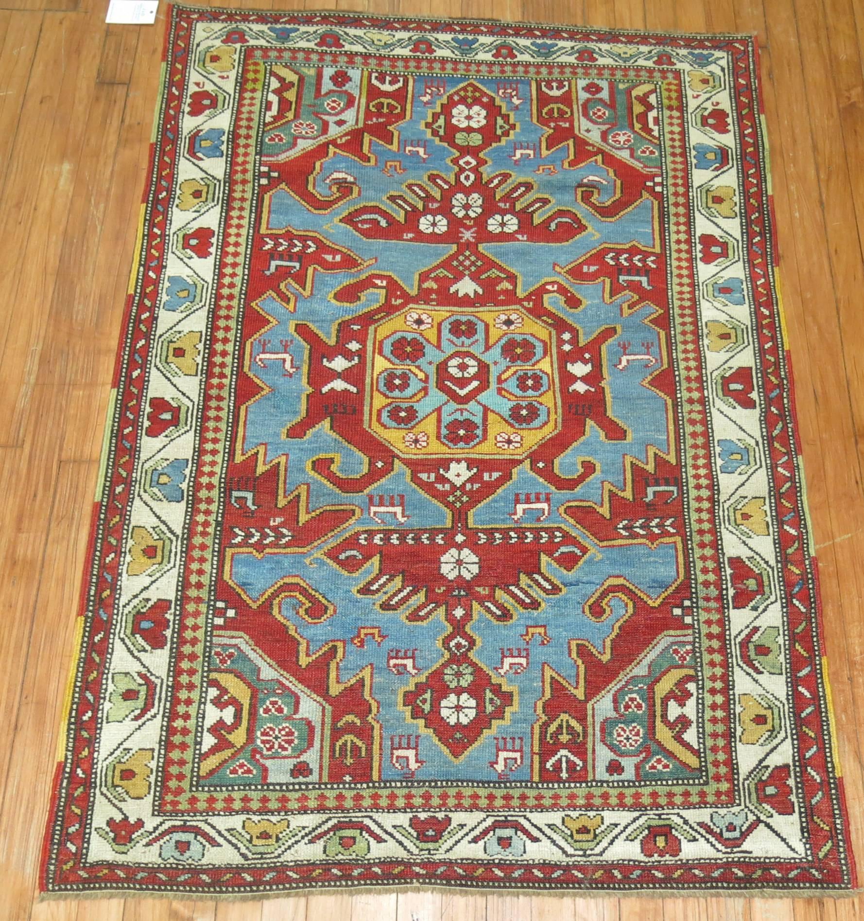 Beautiful antique tribal Caucasian rug featuring a turquoise background. Excellent quality and colors.