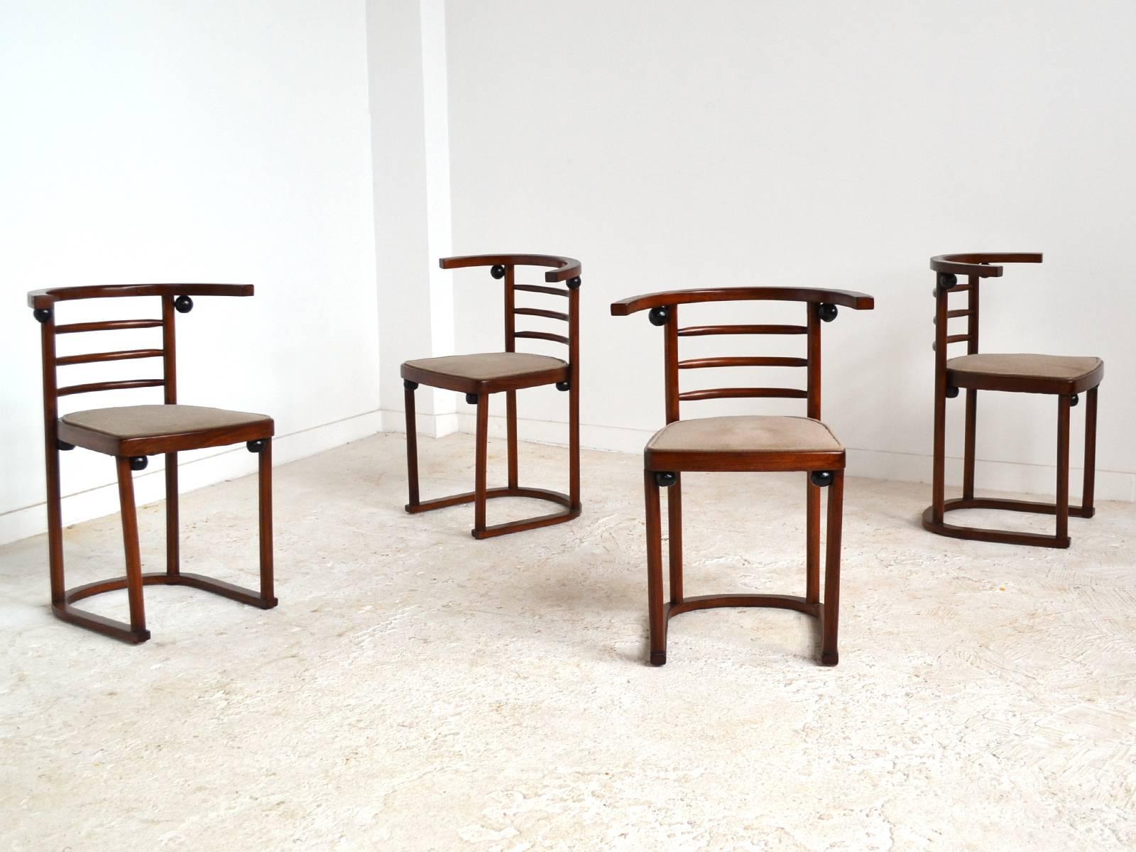 Originally designed by Joseph Hoffman for the Café Fledermaus in 1907, this set of four chairs was made by Thonet. The frames of stained and ebonized beech have seats upholstered in mohair.