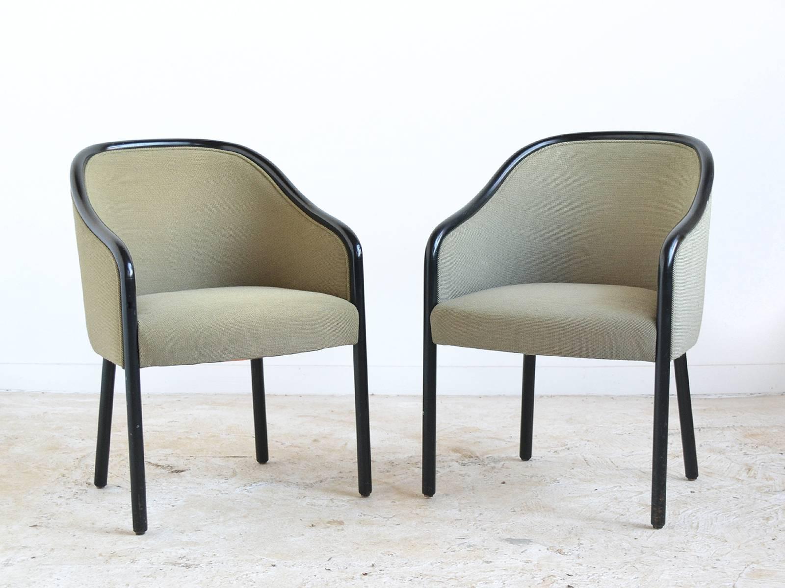 Ward Bennett's highly refined aesthetic combines subtle, graceful shapes and exquisite craftsmanship. The classical proportions of these wood framed armchairs allows them to work in any interior. The black lacquered wood legs and surround provide a