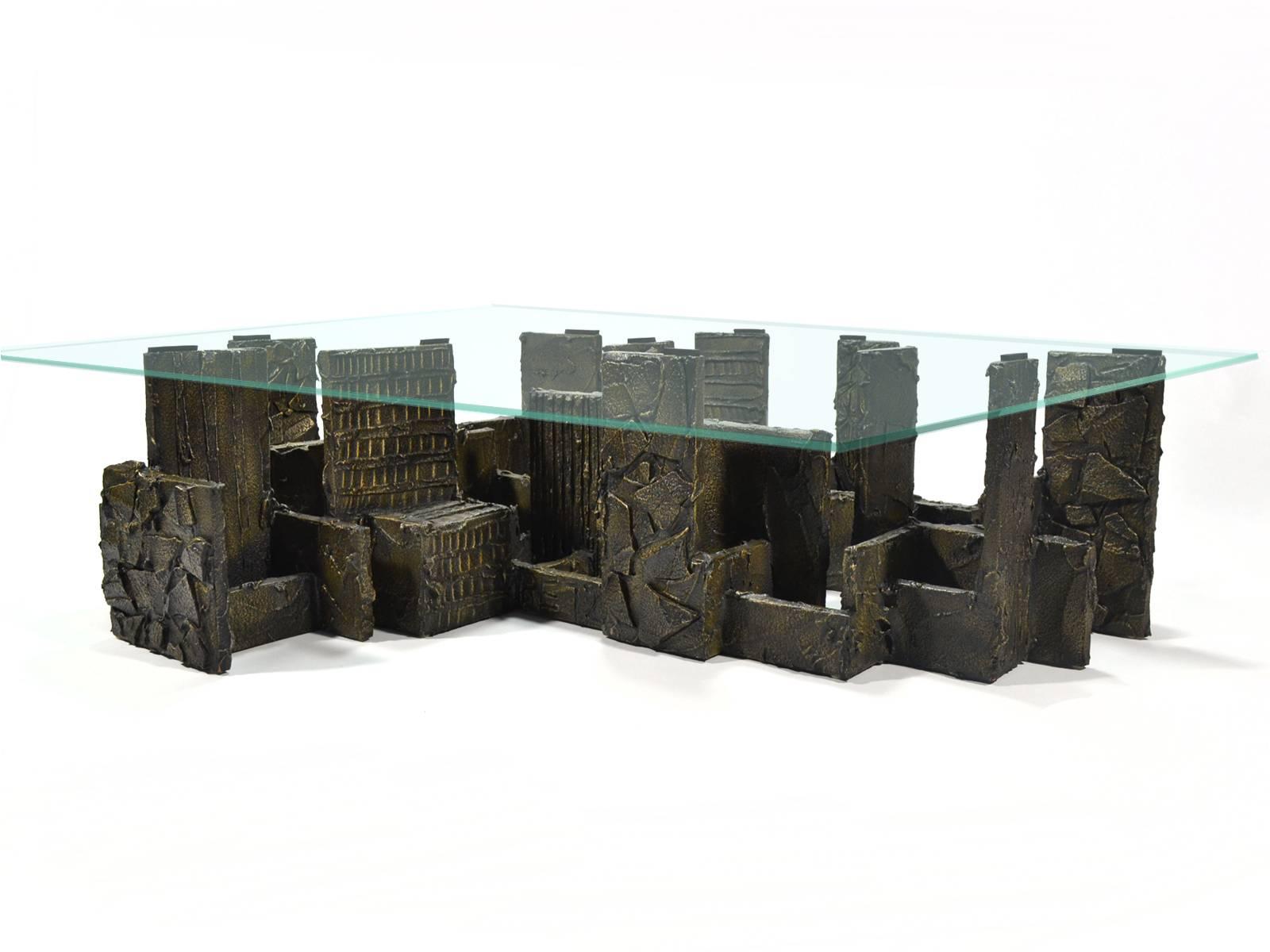 This exceptional coffee table by Paul Evans was a custom order and is the largest we've ever seen of his sculpted bronze series. The architectural base, an arrangement of heavily textured slabs in a beautiful composition, reminds us of a city