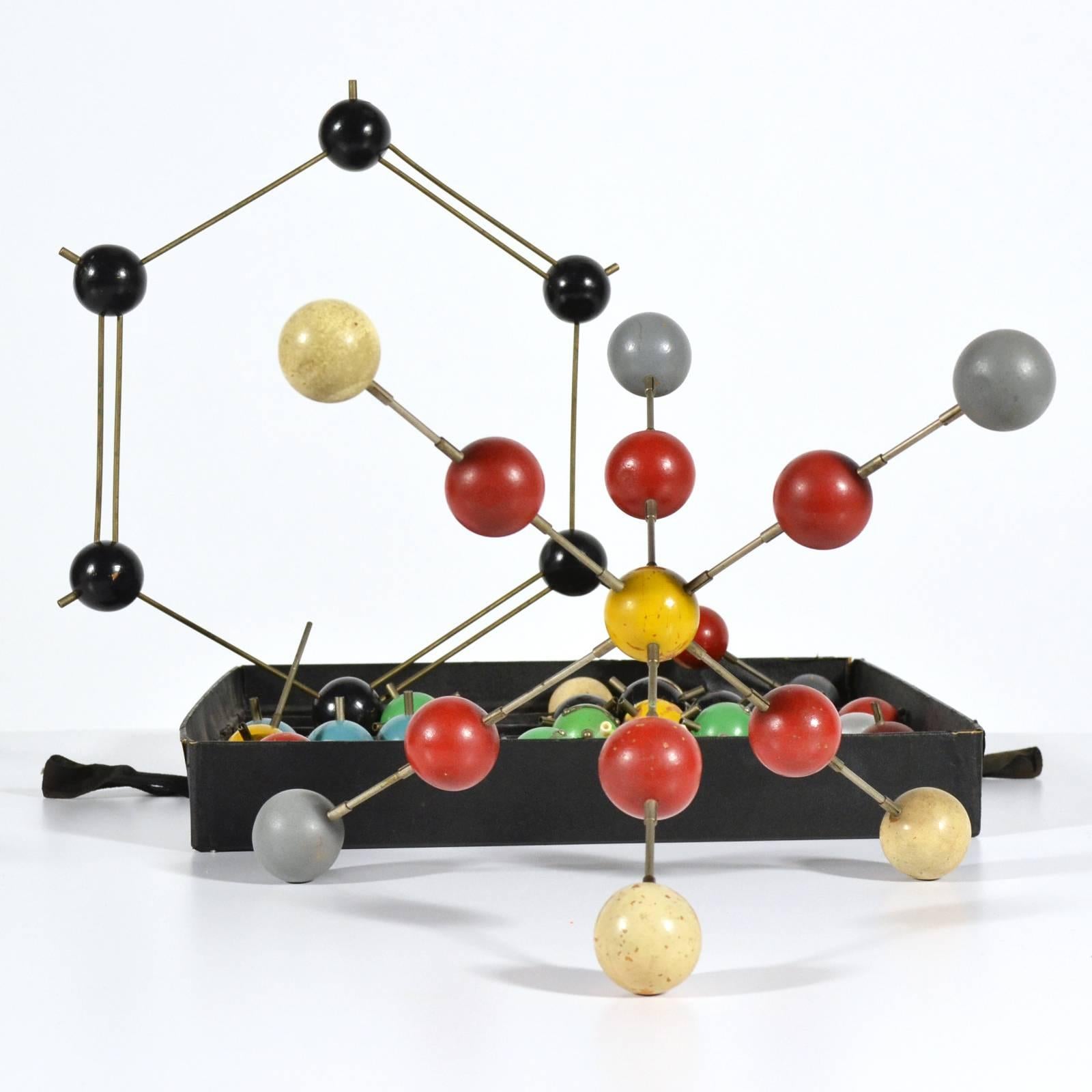 This delightful old collection of wooden balls and metal connectors was used in classrooms to assemble different molecules. Colorful, fun, and visually compelling, the pieces can be arranged to illustrate actual molecules, or simply put together in