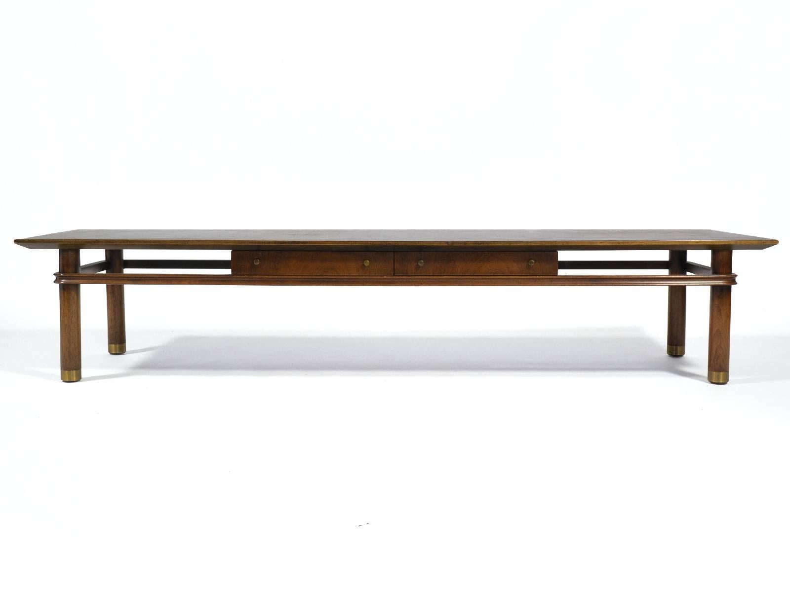 A beautiful design which reflects the refined aesthetic of Bert England and the quality construction of Johnson Furniture. This long, low piece can serve equally well as a coffee table or a bench. It features two shallow drawers a sculpted