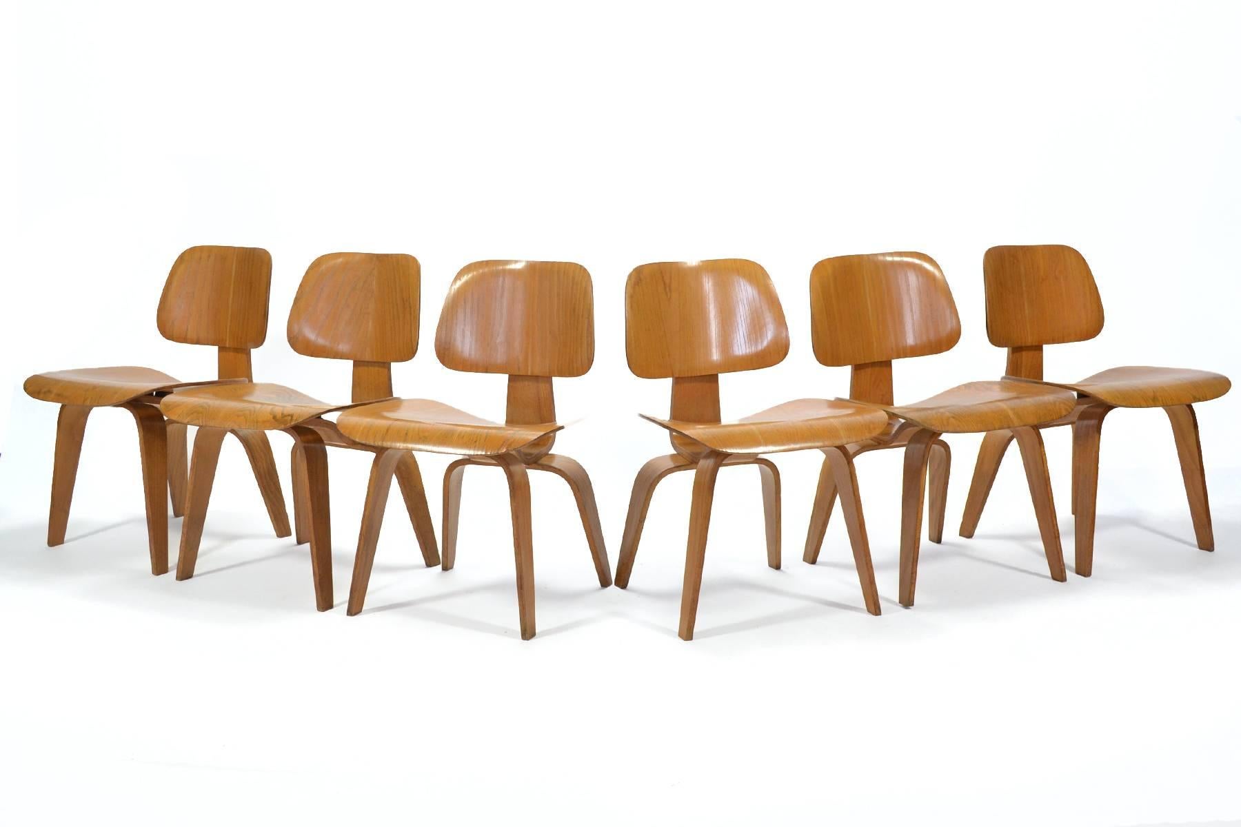 This rare set six of early Eames DCW (Dining Chair Wood) were produced by Evans for Herman Miller in the late 1940s. One of Charles and Ray's most important designs, the DCW was the result of their wartime experiments in molding plywood. They were