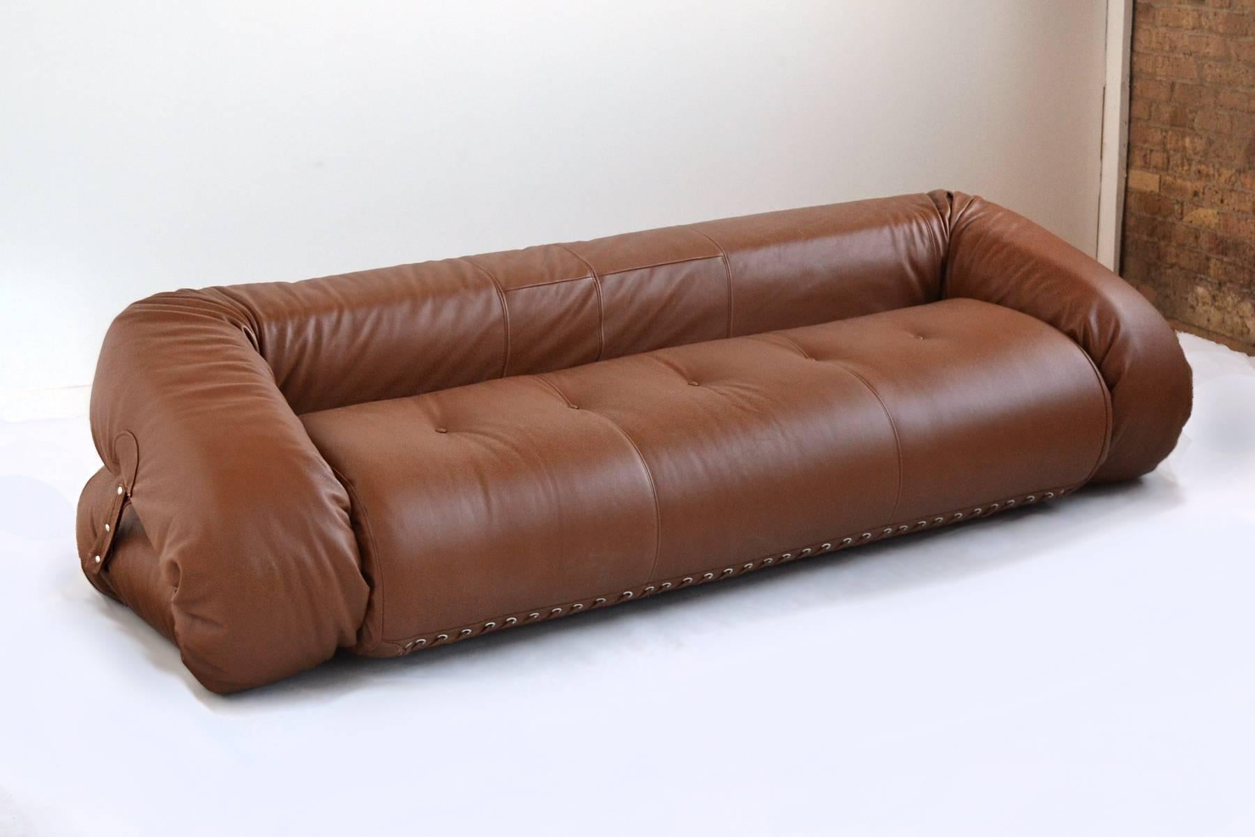 This design is characteristic of Italian design: Well made of luxurious materials, innovative, and full of joy. The playful design is a plush sofa when folded onto itself, but when opened, serves as a bed which resembles a life raft.