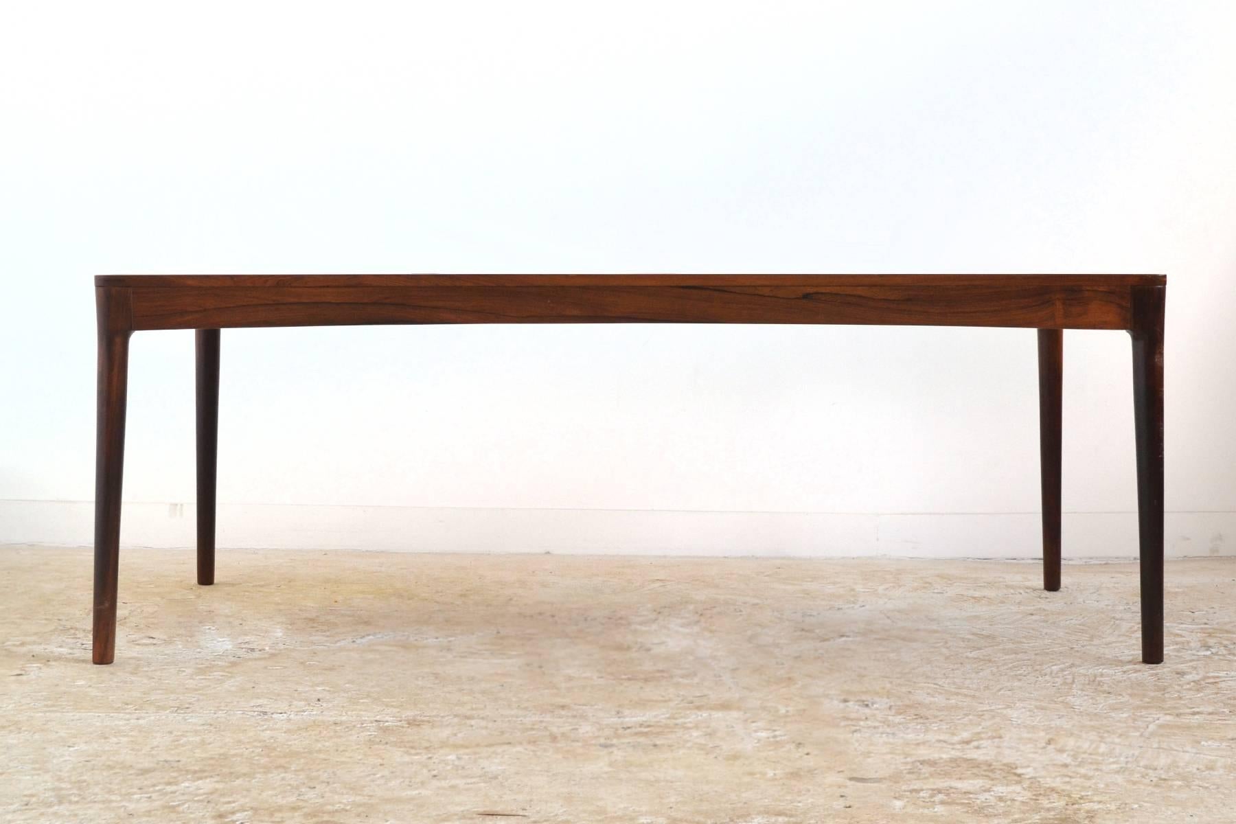 Like so much of the best Danish design, this table is a study in subtle beauty and expert craftsmanship. A substantial table, it is made of rich rosewood sculpted in graceful lines with visible joinery and fine details.