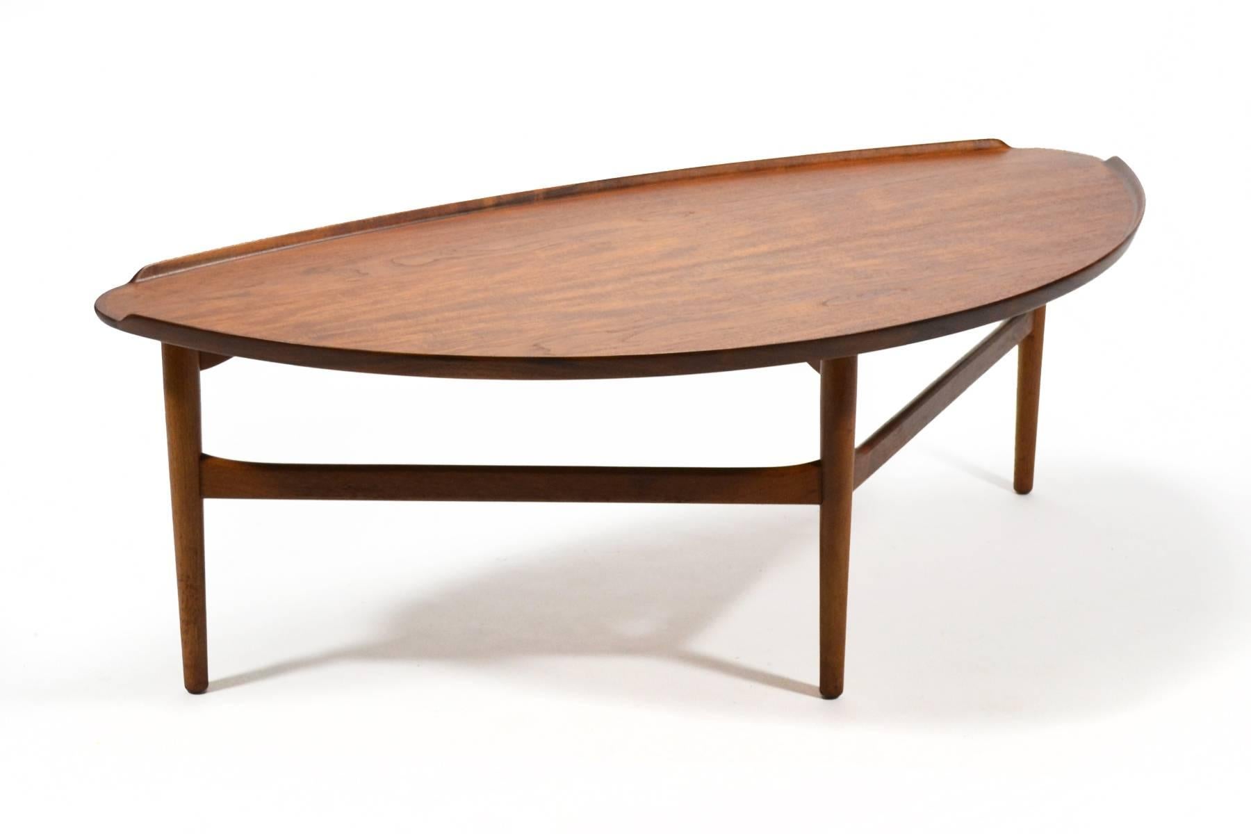 Designed by Danish master Finn Juhl and crafted by Baker Furniture in the US, this large cocktail table is exquisite.

Finn Juhl was skeptical that any American manufacturer could produce his designs to his exacting standards. After visiting Baker