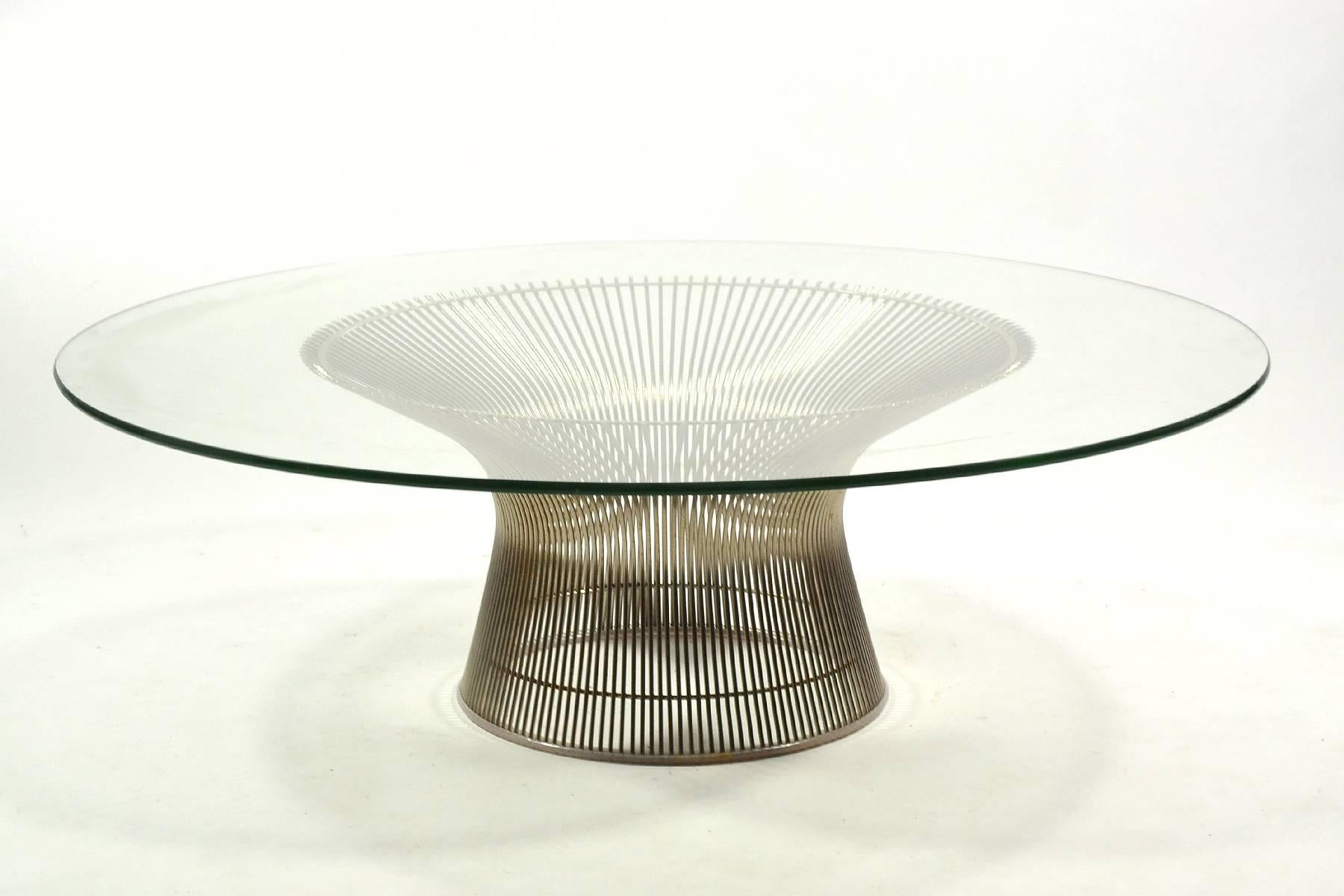 An exceptional amount of hand work is required to fabricate the Platner coffee table with its many wires and electronic welds. The form recalls a sheaf of wheat and the layers of wire rods create beautiful moiré patterns. This vintage example has