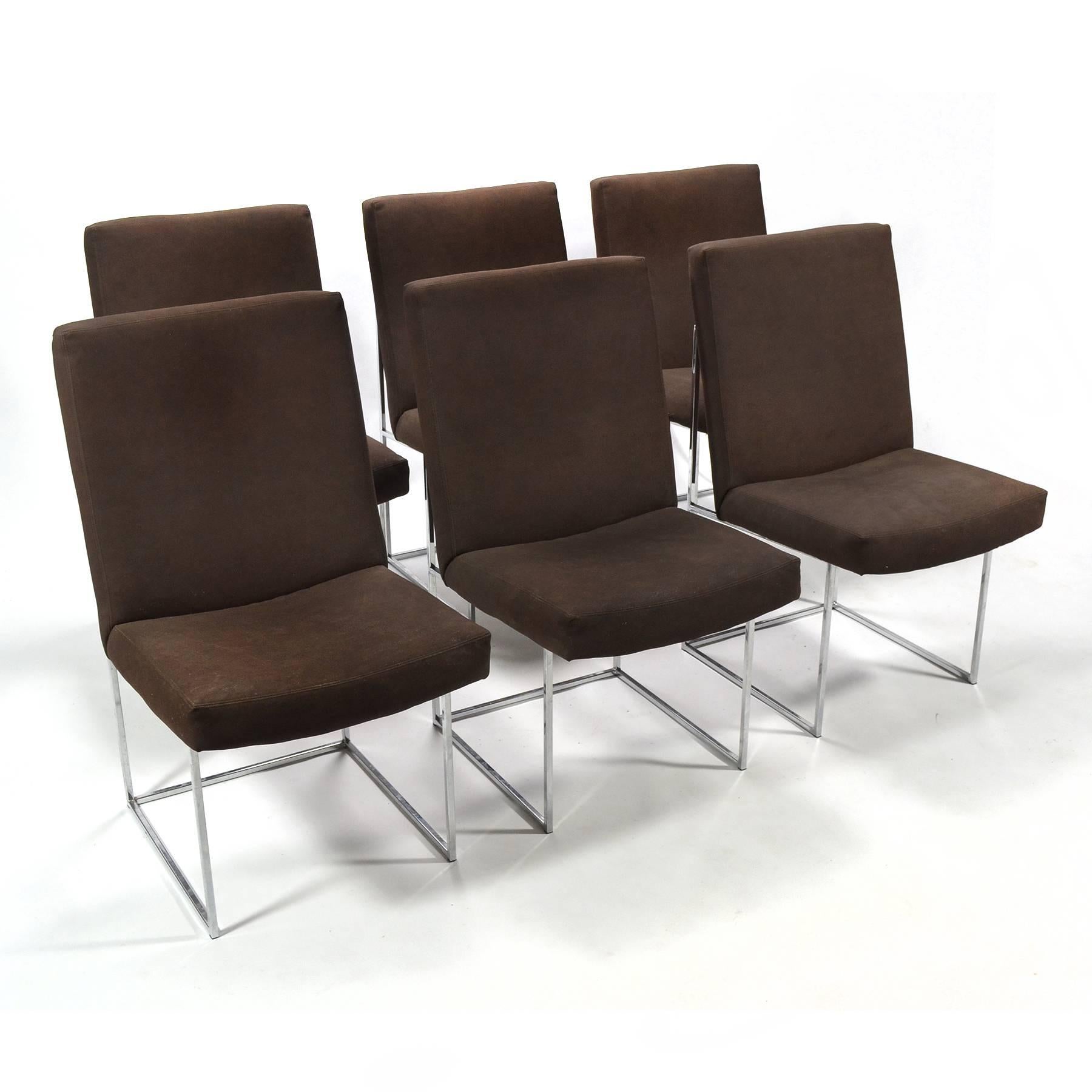 This is one of our favorite designs by Milo Baughman. These dining chairs have a beautiful architectural base of polished chrome square stock steel supporting an upholstered seat and back. The clean, unadorned design is almost starkly minimal and