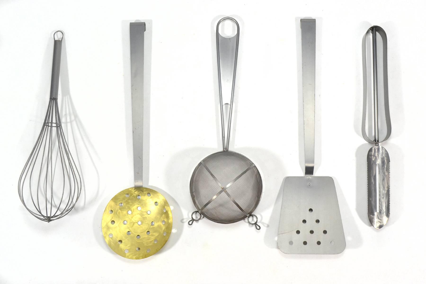 This delightfully playful set of giant cooking utensil sculptures by Curtis Jere' is uncommon for its number of pieces. It includes a peeler, a spatula, a colander, a strainer and a great big whisk. They are large and dramatic making a powerful