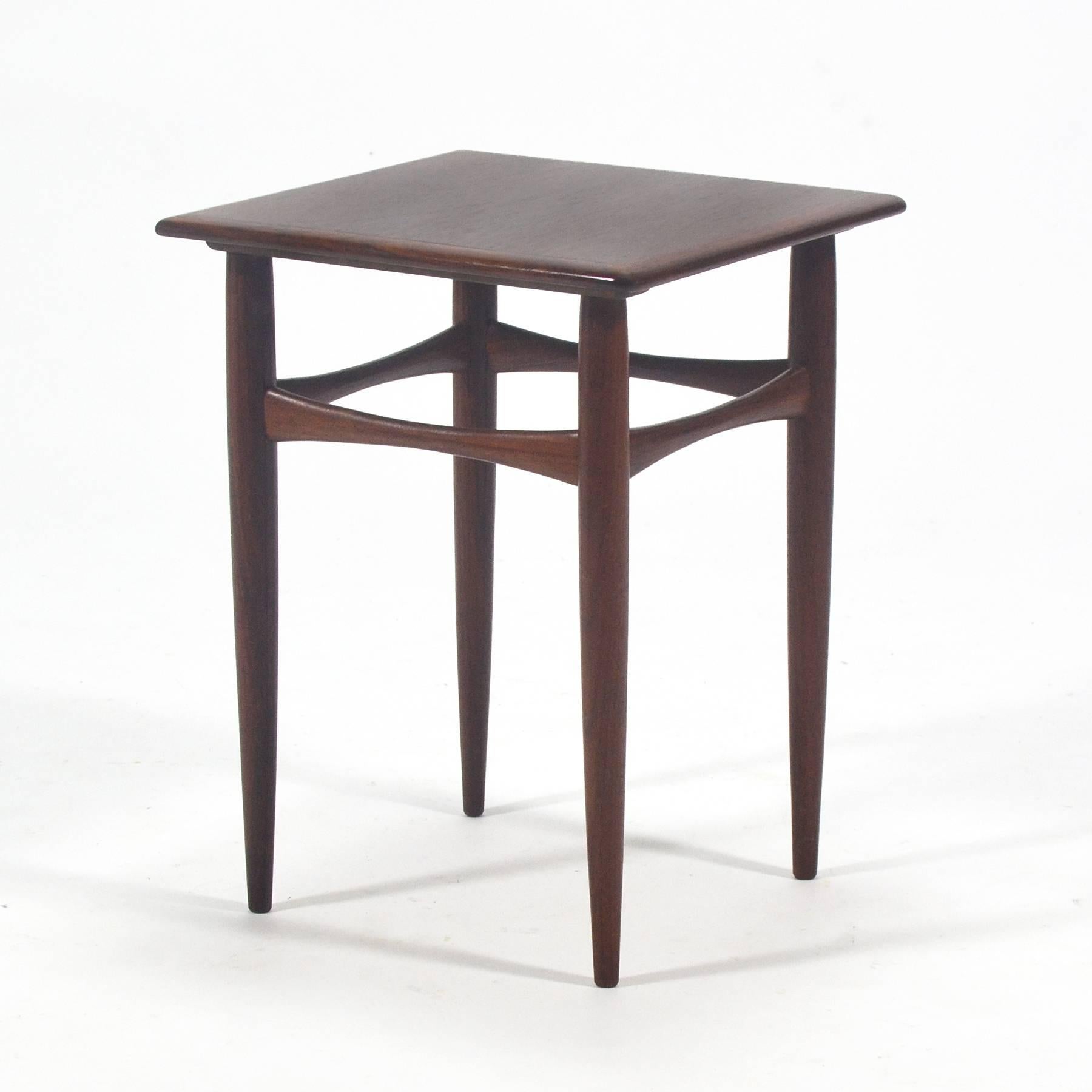 This delightful diminutive side table by Arne Hovmand-Olsen is crafted of rich rosewood and has subtle, beautiful lines which are distinctively Scandinavian.
