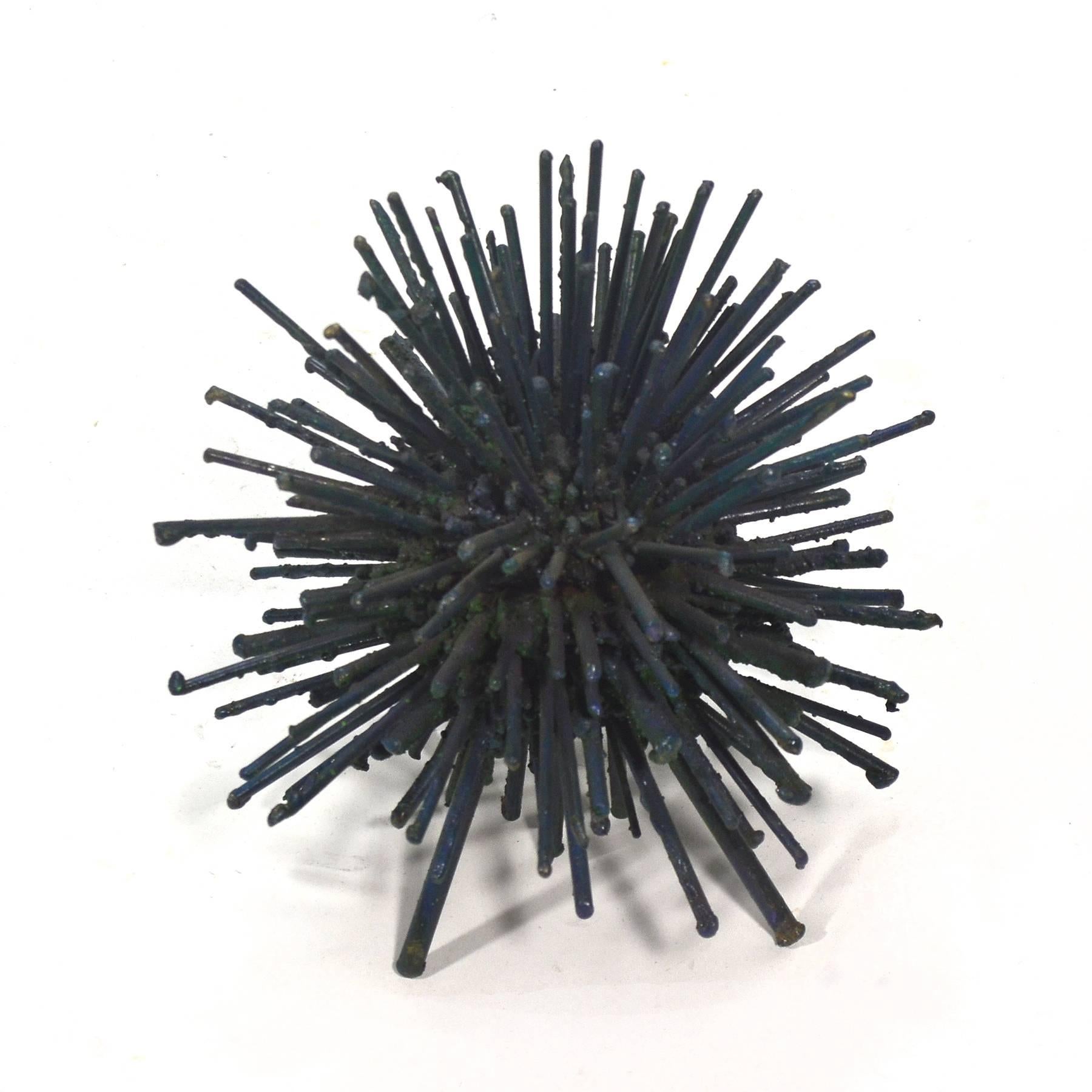A wonderful and whimsical piece by sculptor James Bearden, this piece is composed of rods arranged in a dense burst reminiscent of the dandelion sculptures by Harry Bertoia. The sculpture has a wonderful composition, great texture, and subtle color,