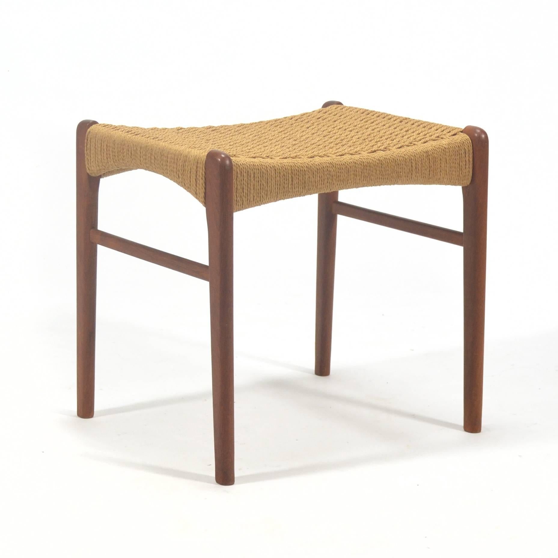This teak stool by Peder Kristensen for Glyngore Stolefabrick is a beautiful example of Classic Danish modern design. Expert craftsmanship, fine lines and a seat of woven papercord make this the perfect occasional piece.