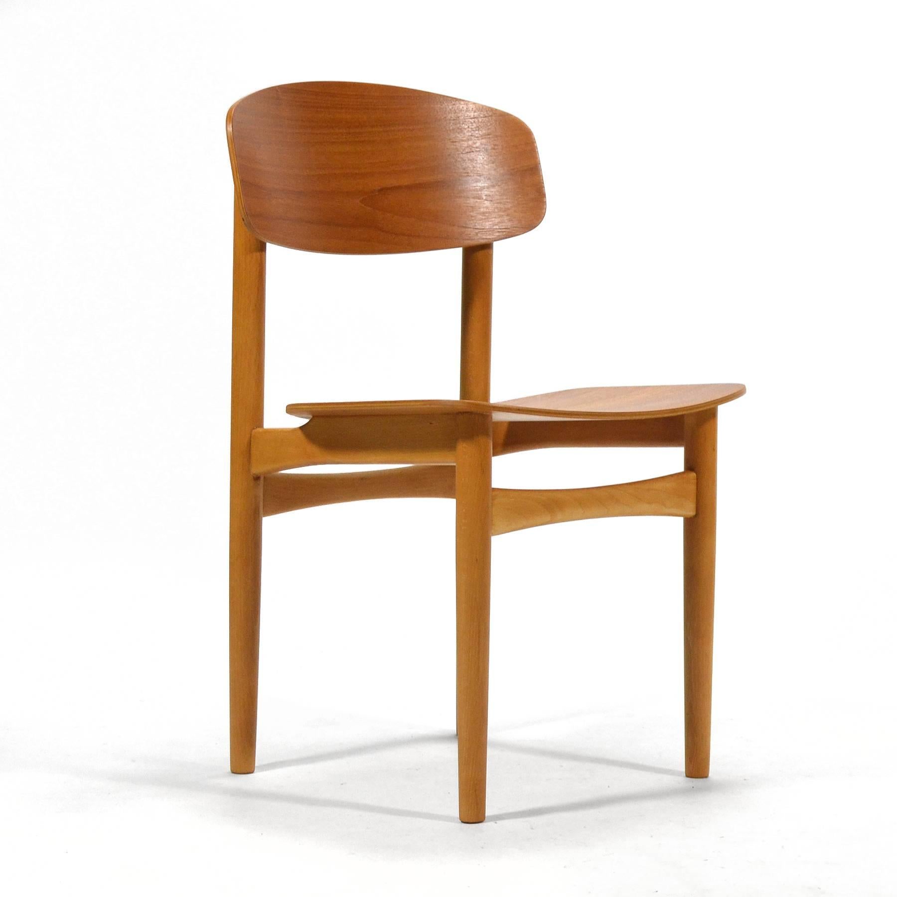 These  beautiful side chairs by Børge Mogensen for Søborg show the global influence of Charles and Ray Eames' molded plywood designs. Mogensen combines a teak seat and back with a birch frame that exhibits his love of Shaker simplicity. With expert