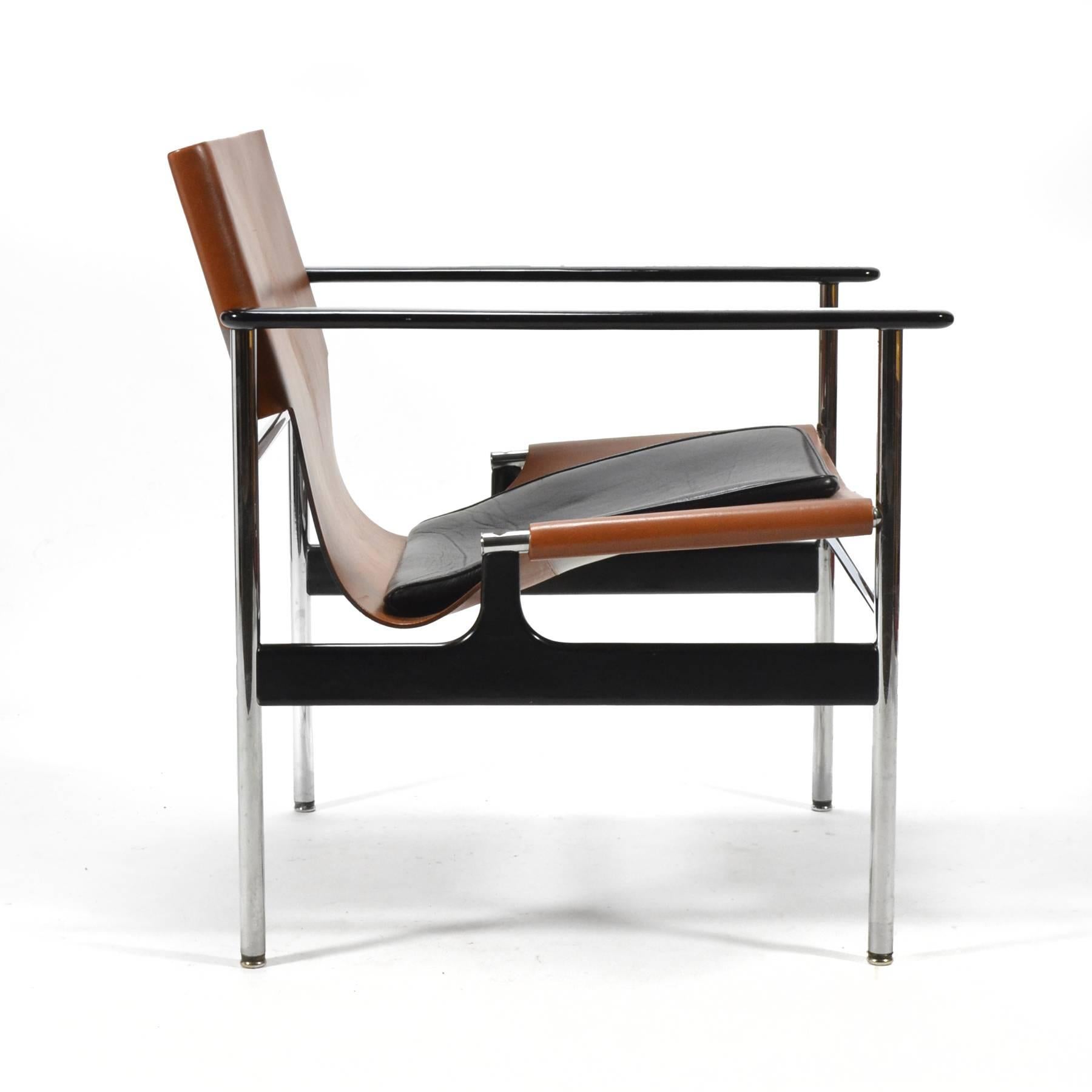 Charles Pollock's 1960 design for Knoll references Le Corbusier's LC1 lounge chair while incorporating new materials. A surprisingly comfortable easy chair, the seat has a wonderful relaxed pitch, the leather sling cradles the sitter, and the padded