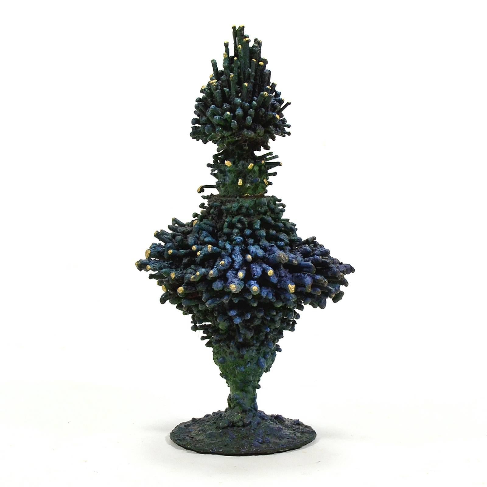 This sculpture by James Bearden has an intense visceral texture and doubles as a vessel with a removable top.