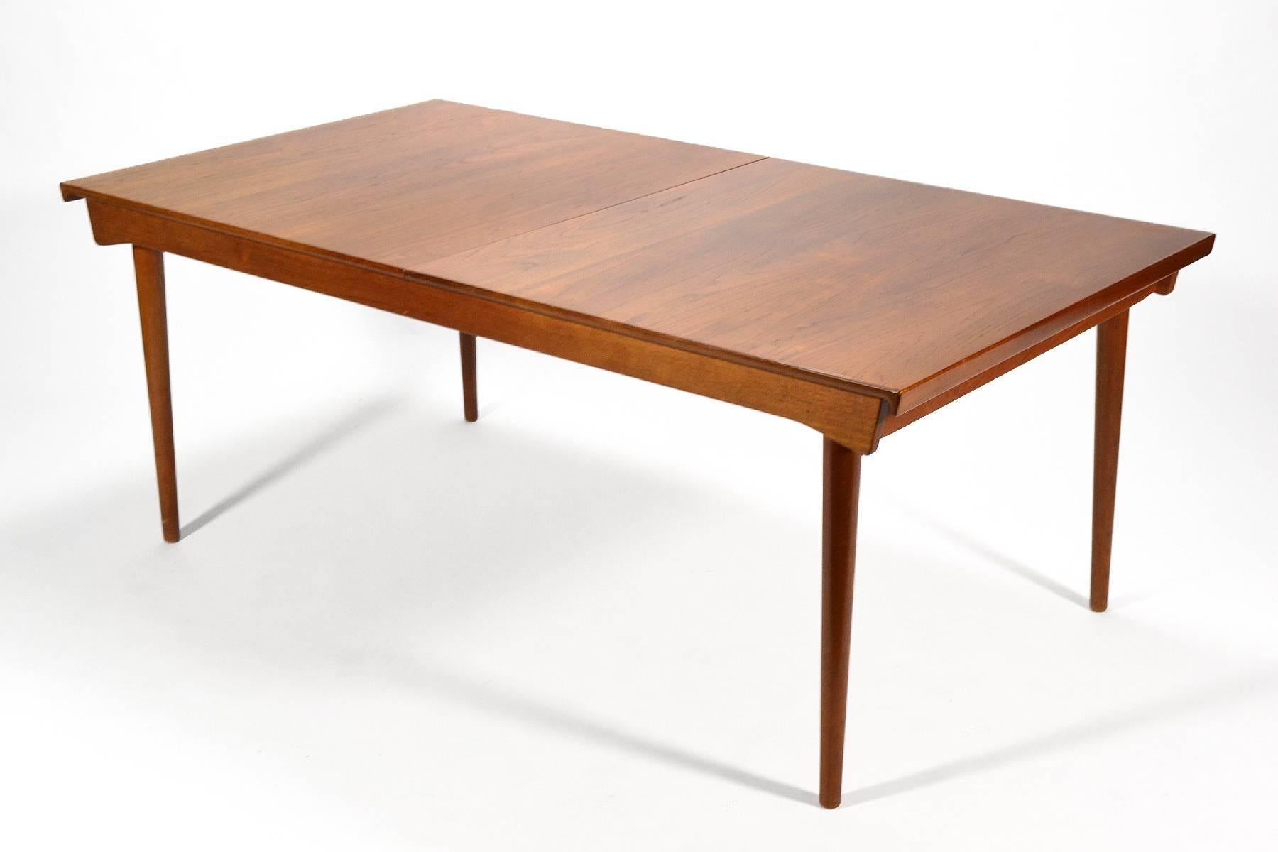 Danish master Finn Juhl's importance cannot be understated and whether he was collaborating with Neils Vodder or France & Sons his sensibility shines. This table is a perfect example. Crafted of solid teak, it features a top with sculpted ends which