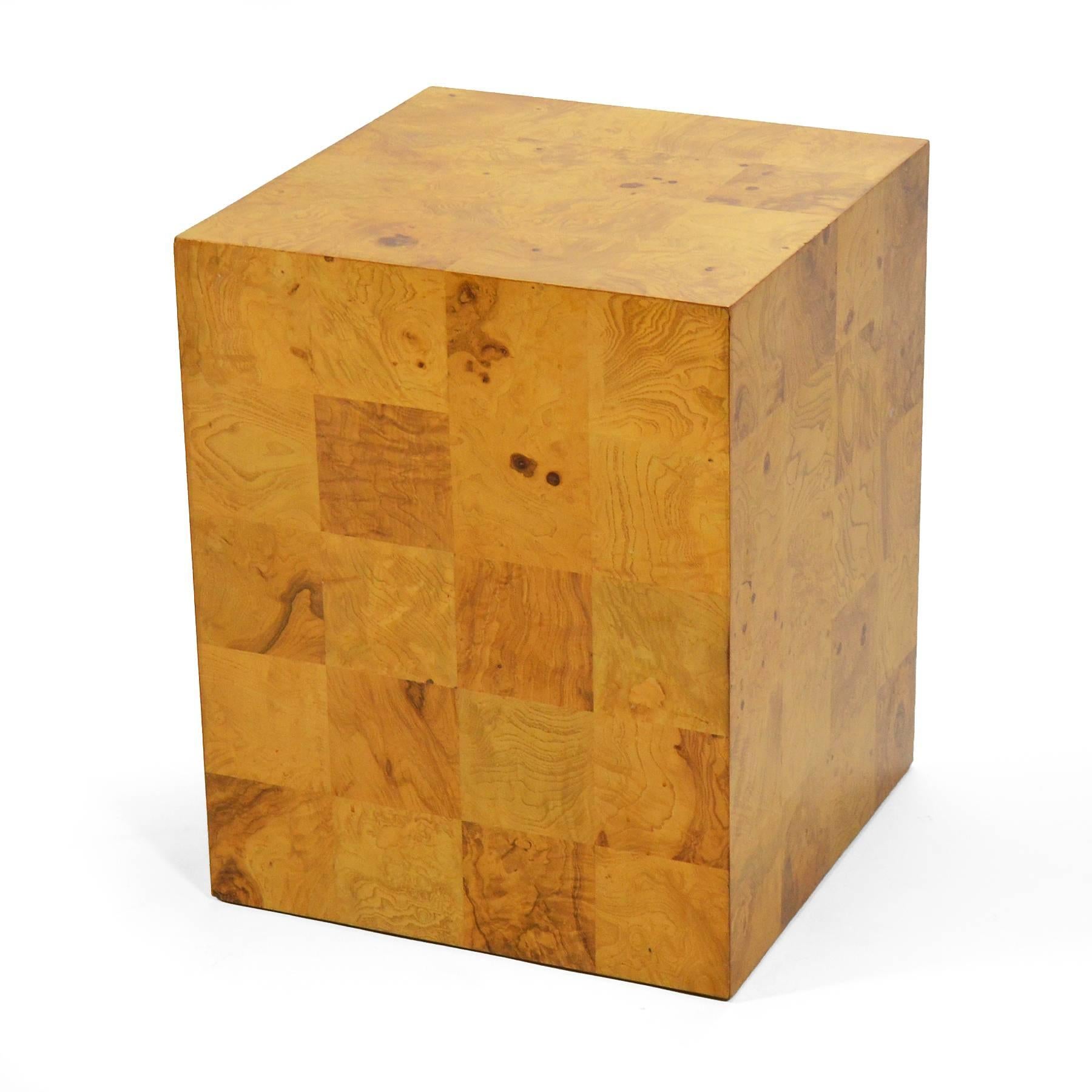 This design by Baughman is as spare as it is serviceable. The Minimalist form is embellished with a patchwork of rich burled veneer and the scale allows it to serve perfectly as an end table, lamp table, or pedestal for art or objects.