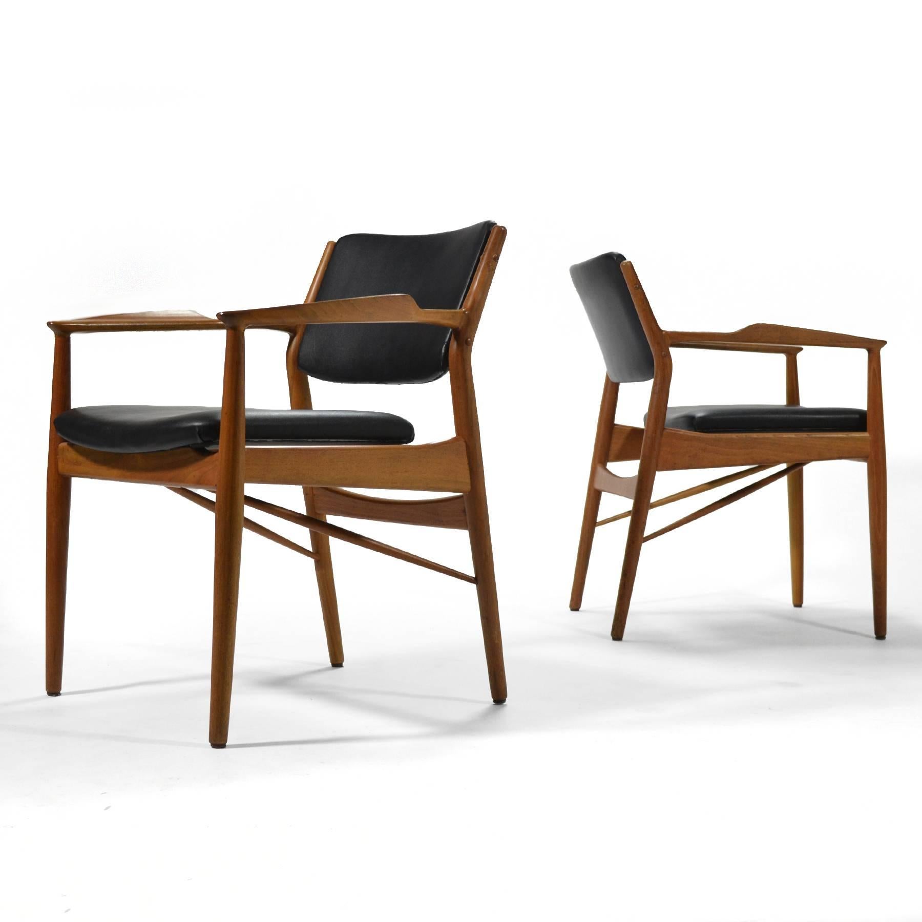 These model 51A Arne Vodder armchairs typify Danish modern as popularized by Finn Juhl. Beautifully crafted by P. Olsen Sibast Møbler, the sculptural teak frames support upholstered seat and backs accentuating their floating quality. 

We have two