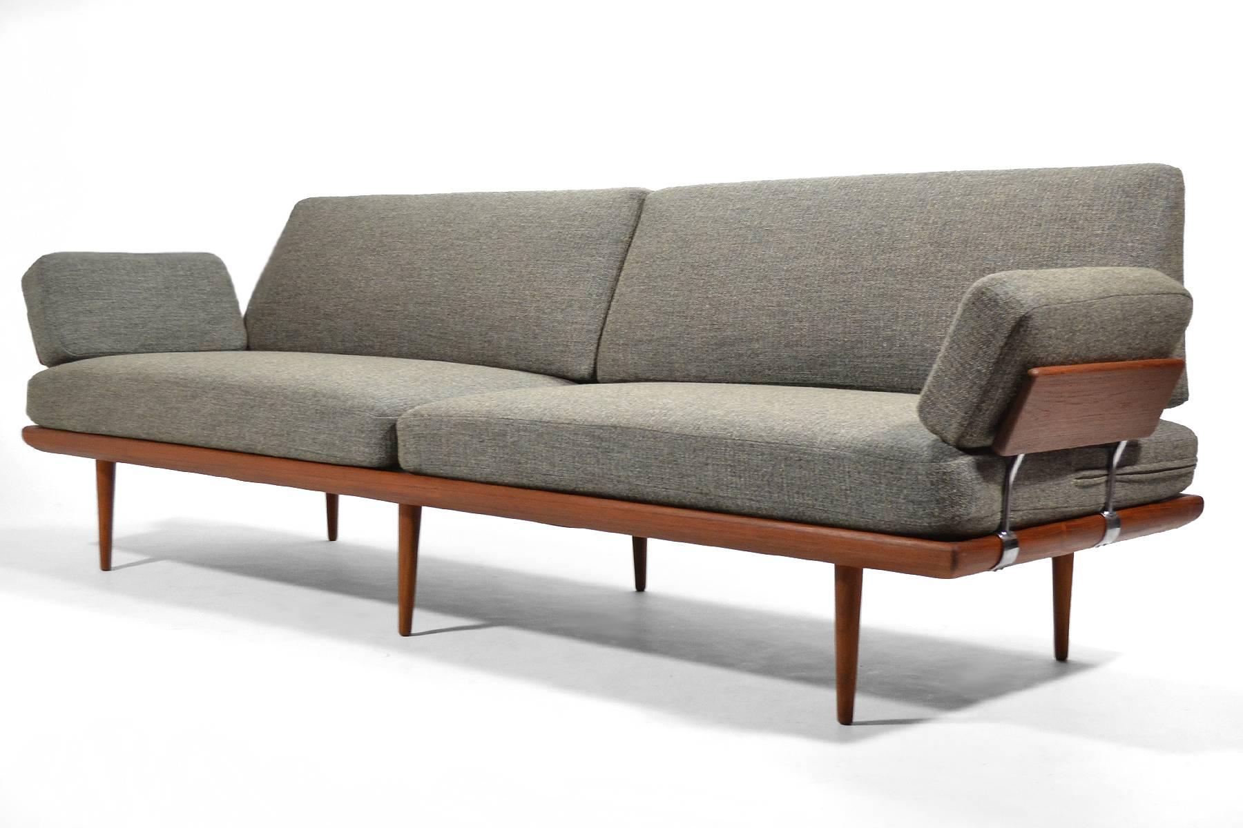 Finely crafted by France & Søn, this rare, extra large version of the Minerva sofa or daybed has a frame of solid teak with steel fittings and comfortable spring cushions which have just been upholstered in a richly textured gray fabric. 

A