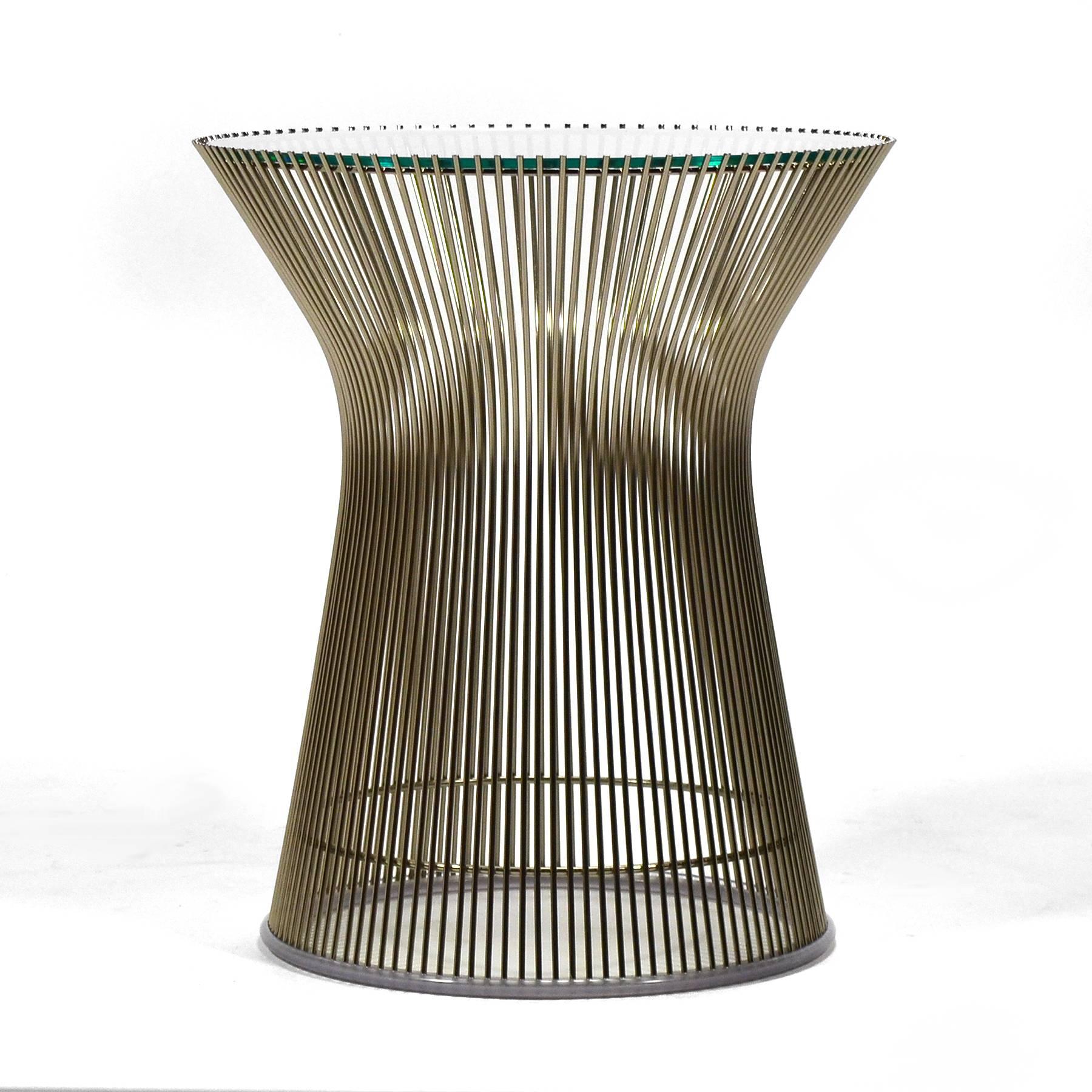 The smallest from the collection of tables Warren Platner designed for Knoll in 1966, this side table nonetheless has great visual presence. The wire rods of the base capture space, create shifting moire' patterns, and support the glass top.