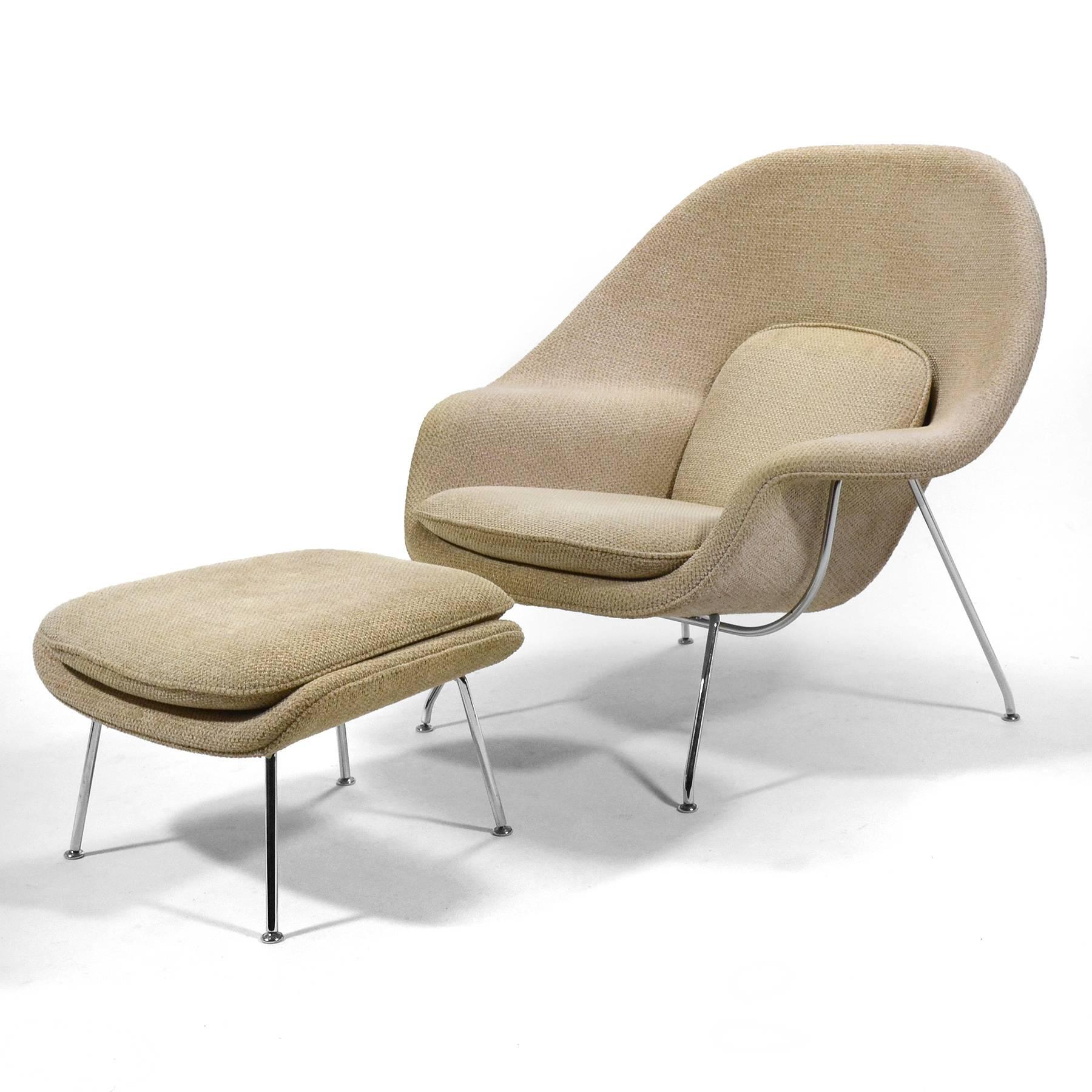 Saarinen's iconic lounge chair and ottoman in a rich, textural fabric. One of the most generous and comfortable modern easy chairs ever designed.

 This chair and ottoman were in a light-filled condo in a highrise. The fabric has been lightened a