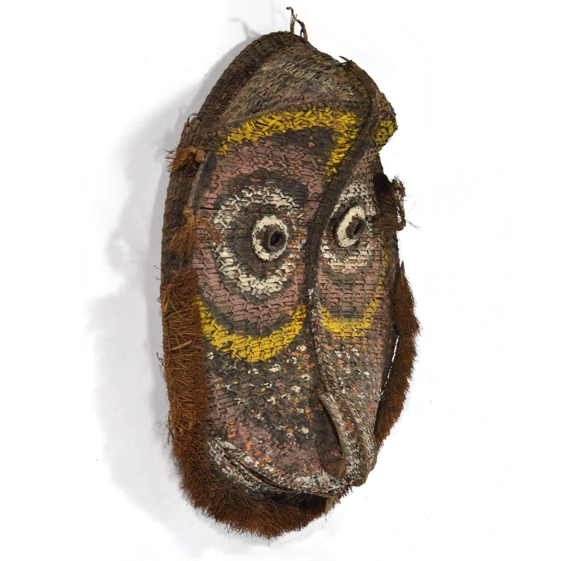 A beautiful and large example of Oceanic art, this delightful woven mask would have been used on the gable of a middle Sepik meeting house. The wildly expressive form is accentuated with natural pigments.
Provenance: collection of Edwin and Lindy