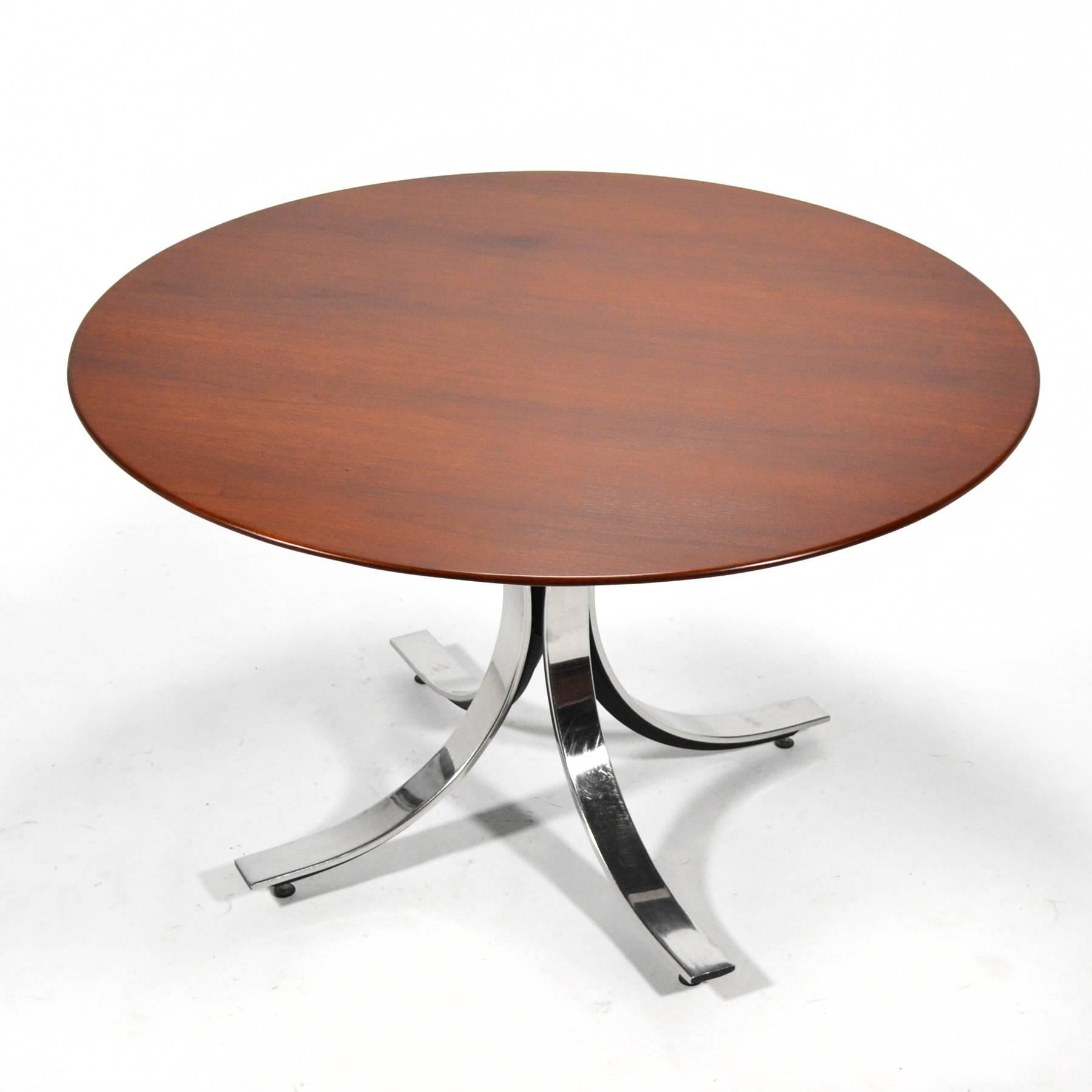 This elegant pedestal table by Borsani has a sexy curved base in chromed and black lacquered steel which supports a walnut top with a beveled edge.