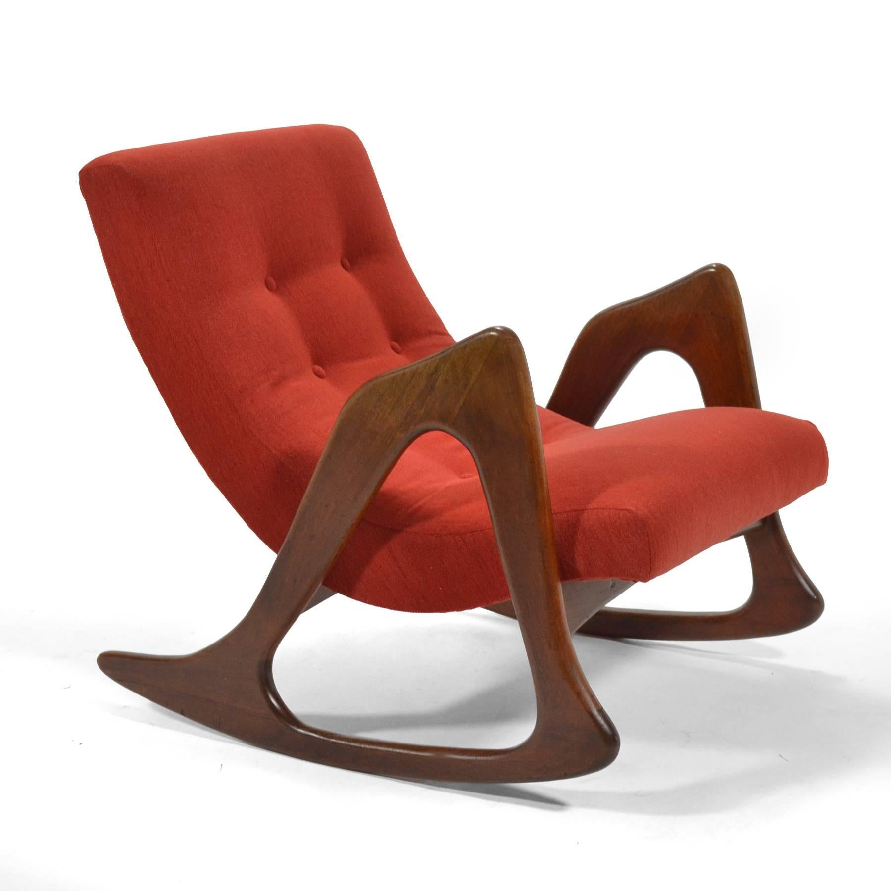Pearsall's best designs are strong sculptural statements with solid walnut arms/ legs supporting upholstered seats. This model 812-CR rocking chair has just been restored and reupholstered.