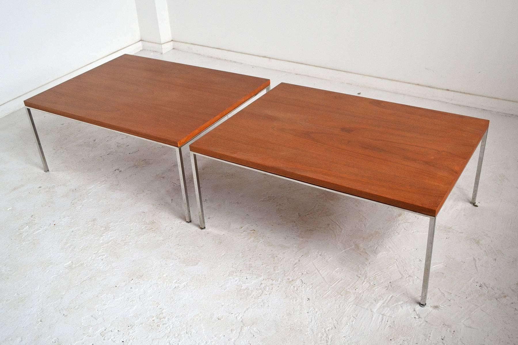 These large scaled tables by Harvey Probber have teak tops supported by chrome steel bases. The size allows them to serve as both end tables, or as coffee tables either alone or in tandem. With its spare form and subtle detailing, this late design
