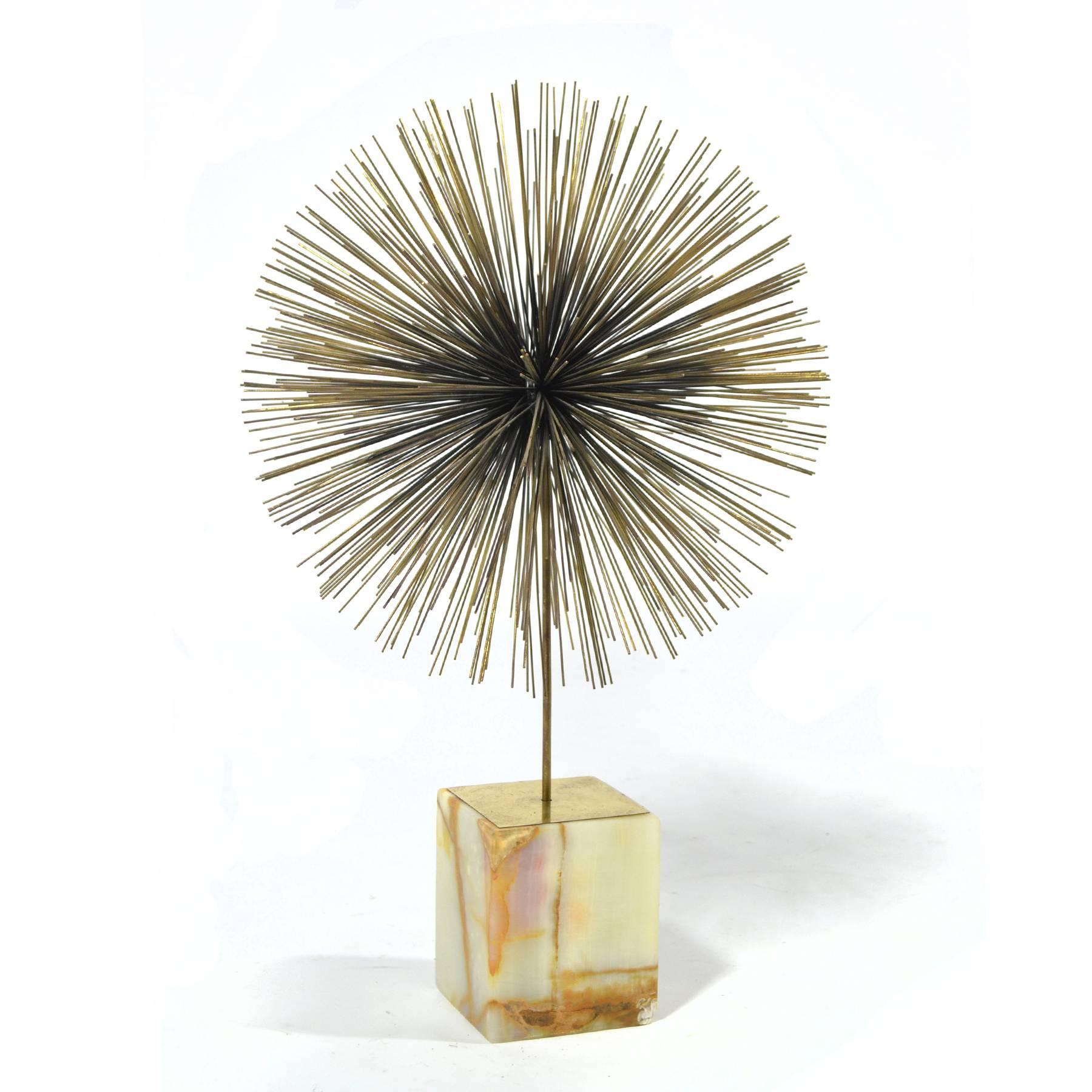 Probably our favourite of all the dandelion or sunburst sculptures created by Jeré is this table top version which features a single round form supported atop an onyx base.