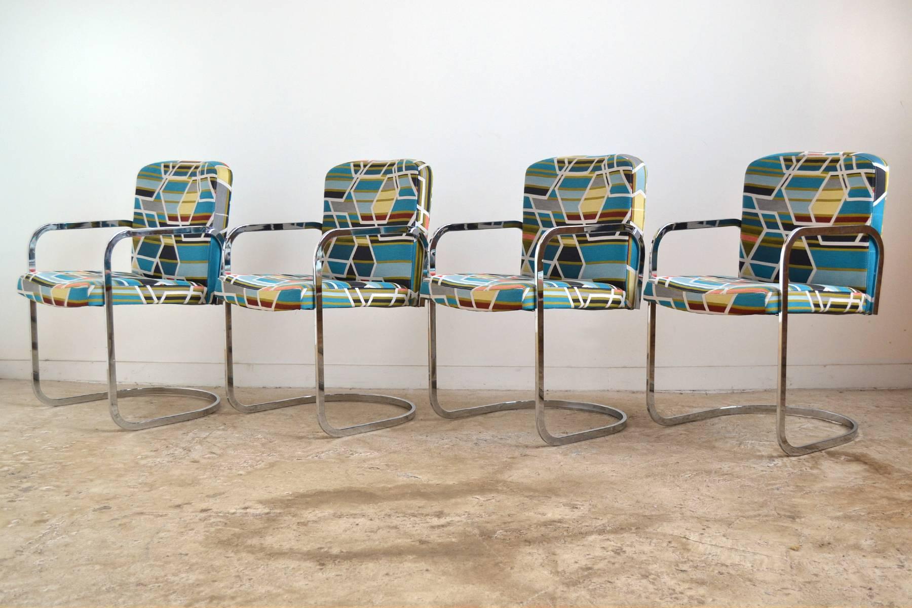 This set of armchairs by D.I.A. clearly take inspiration from Mies van der Rohe's Brno chairs. The chairs have chrome steel frames which support seats newly upholstered in Maraham fabric 
