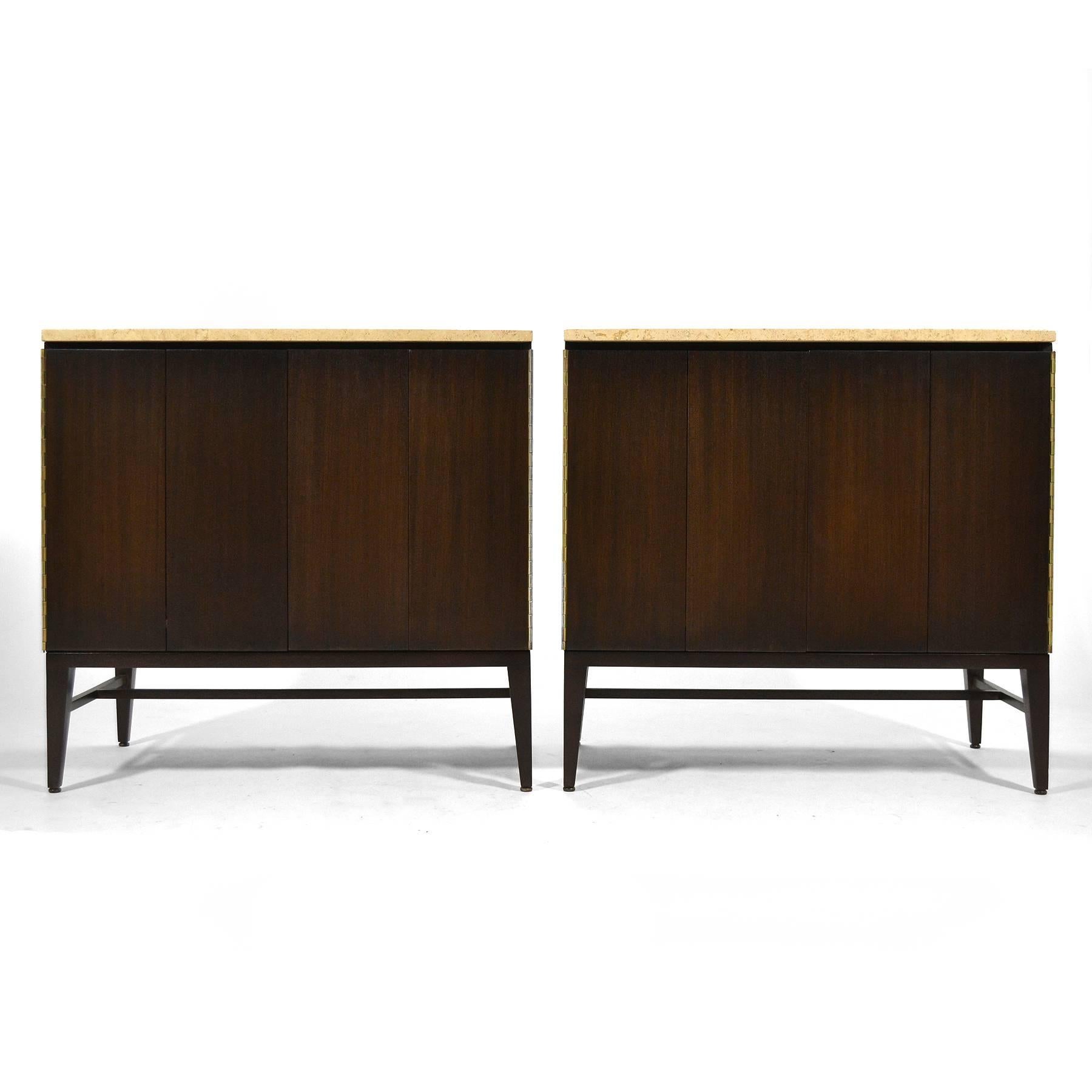 This pair of stunning McCobb cabinets by Calvin have a rich, dark finish on the mahogany cases and are topped with Italian travertine. One is fitted with four drawers, the other a single adjustable shelf. They were used by the original owner as a