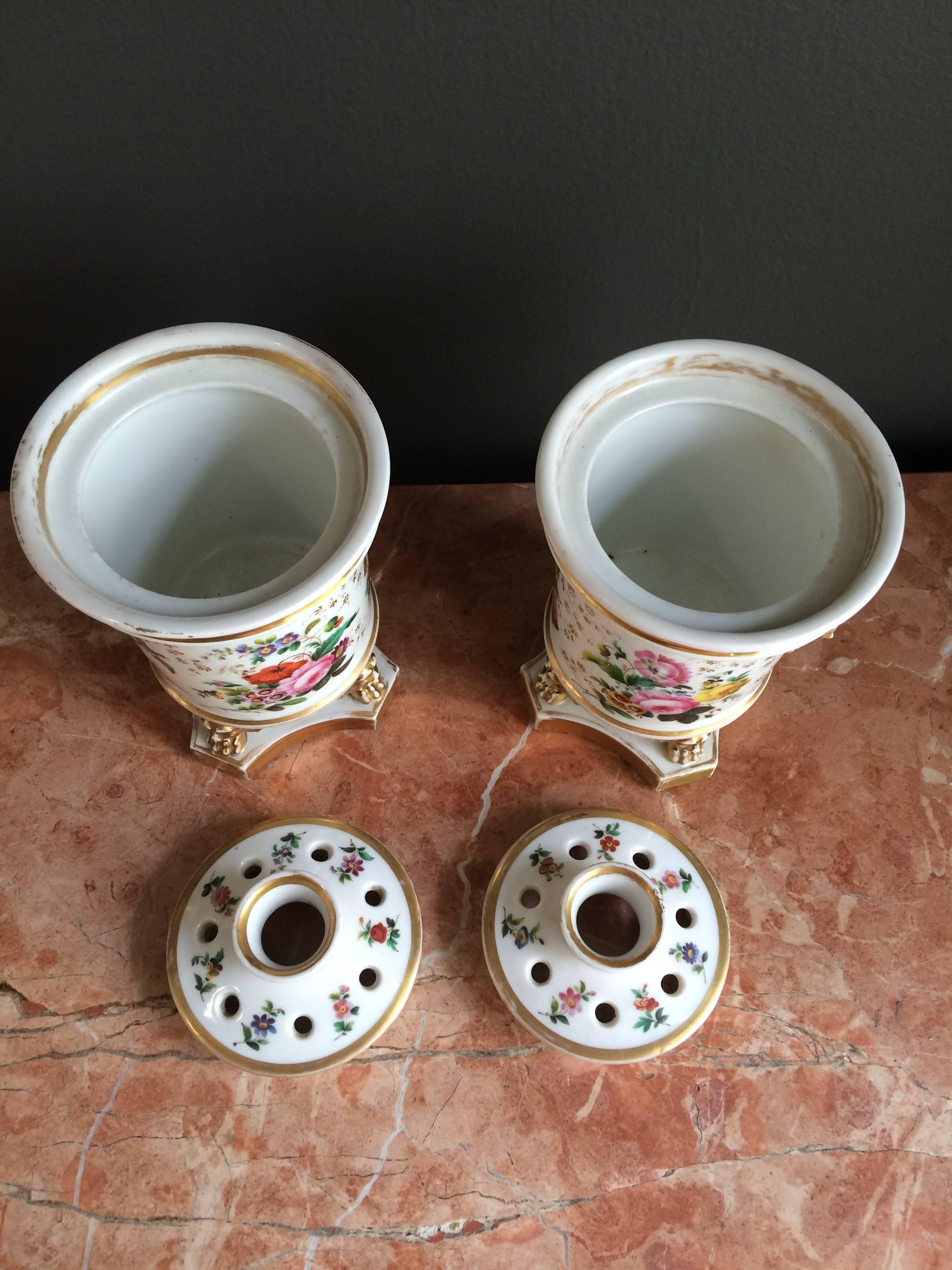 Porcelain Beautiful Pair of Footed Potpourris with Floral Design and Parcel Gilt For Sale