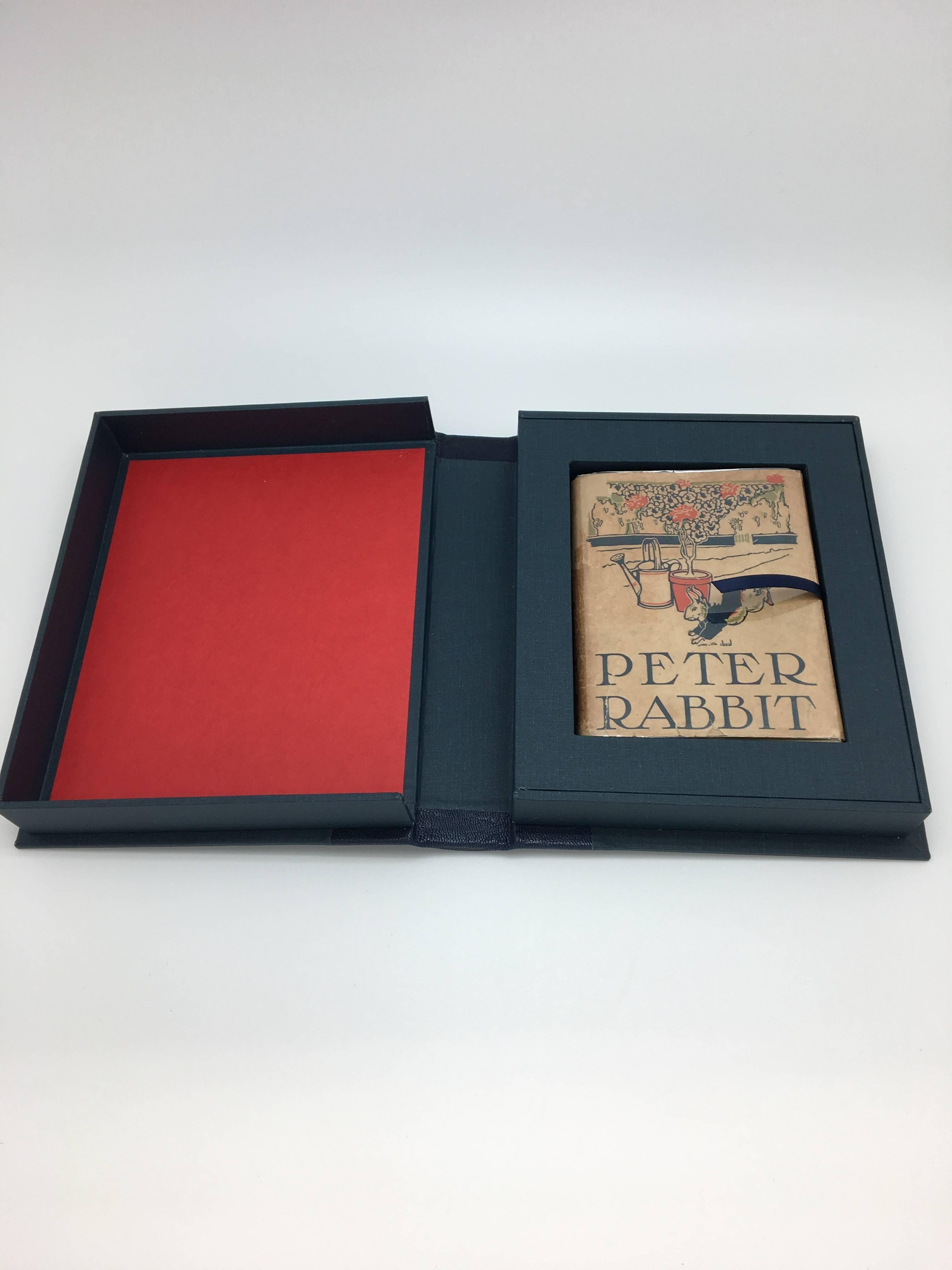 Potter, Beatrix, The Tale of Peter Rabbit. Philadelphia: Henry Altemus Company, 1908-1912. Second American edition, second state, original dust jacket and custom clamshell.

Presented is the second American edition of Beatrix Potter’s children’s