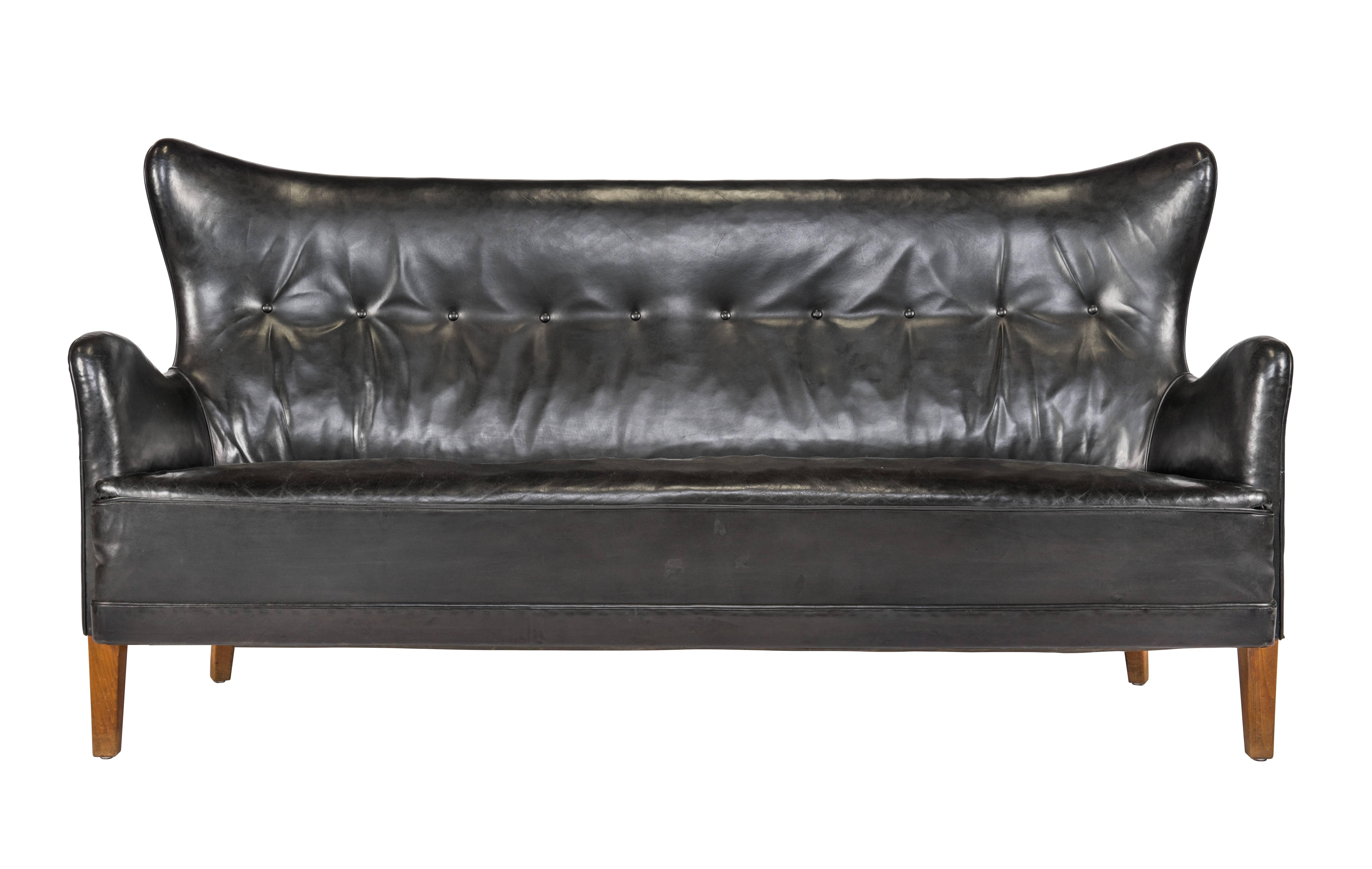 Extremely rare Frits Henningsen sofa in original black Niger leather. Designed 1935, made by cabinetmaker Frits Henningsen. Unusual example of biomorphic Scandinavian design.