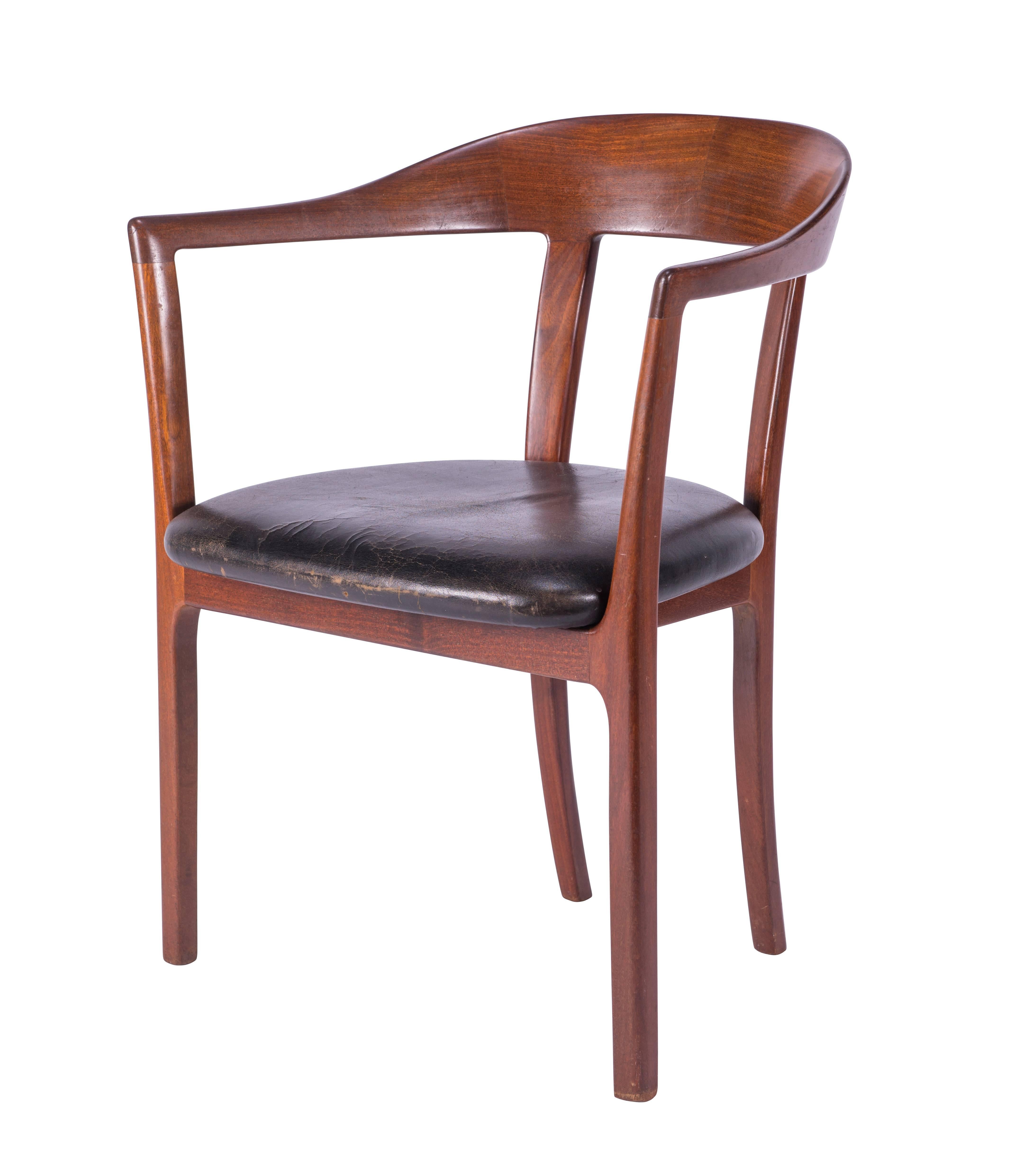 Beautiful and elegant Ole Wanscher mahogany armchair for A.J. Iverson with original black leather seat, circa 1958.