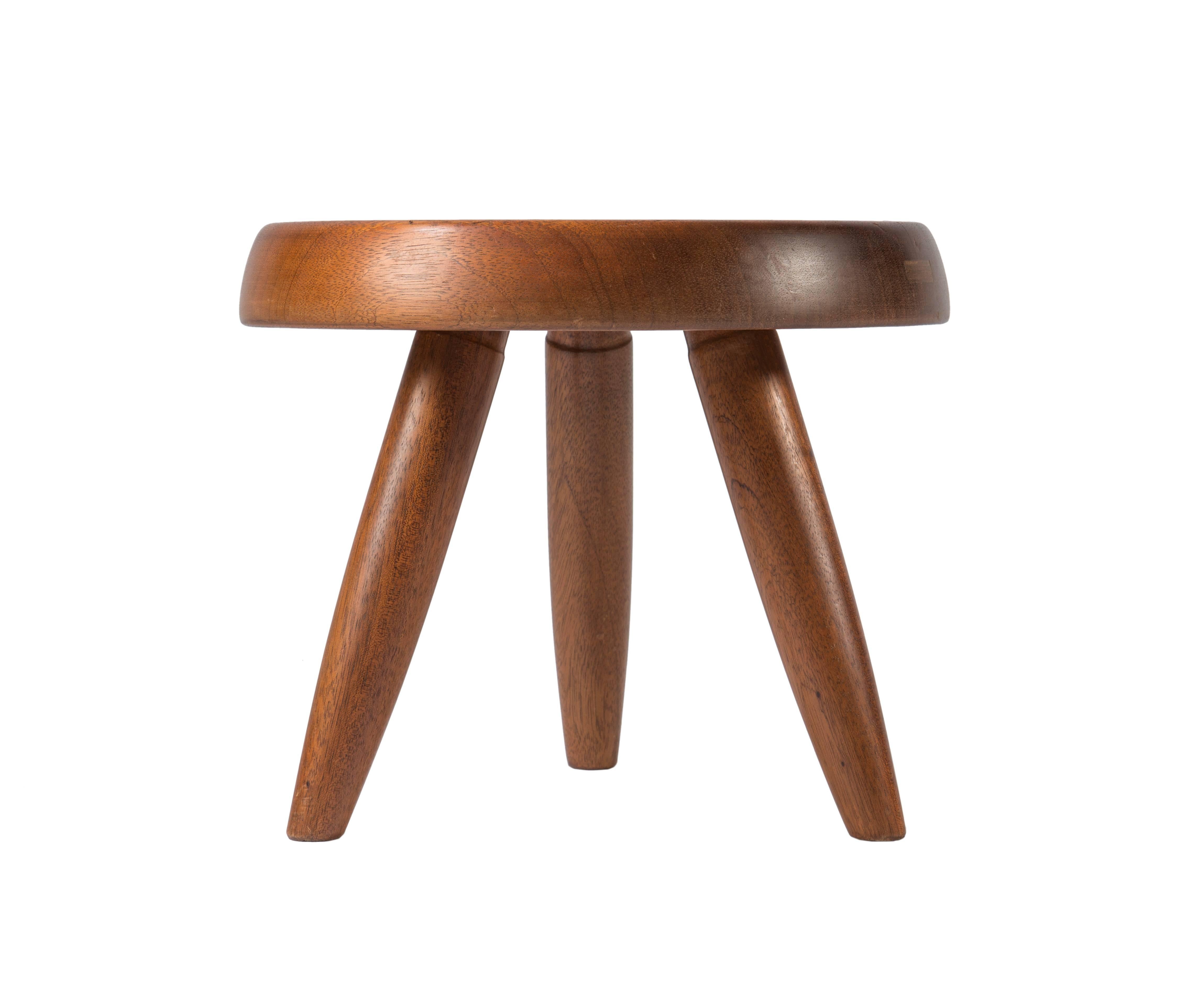 Small teak three legged stool by Perriand, circa 1960s.