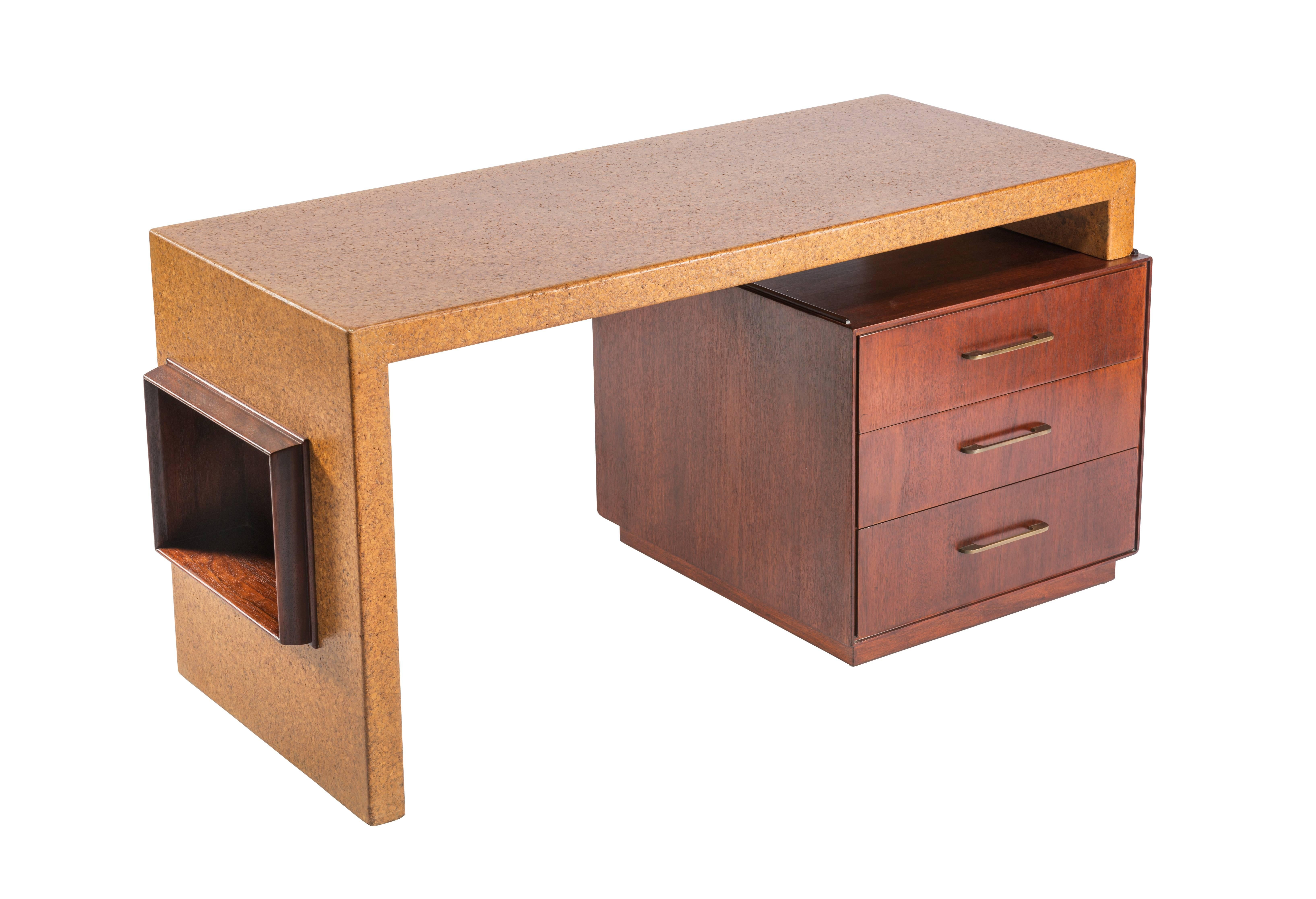 This rare desk is in two pieces and was designed to allow you to slide the top from one side to the other. This also allows you to configure a right or left handed desk. Designed by Paul Frankl for Johnson Furniture.

Length can range from 58-78