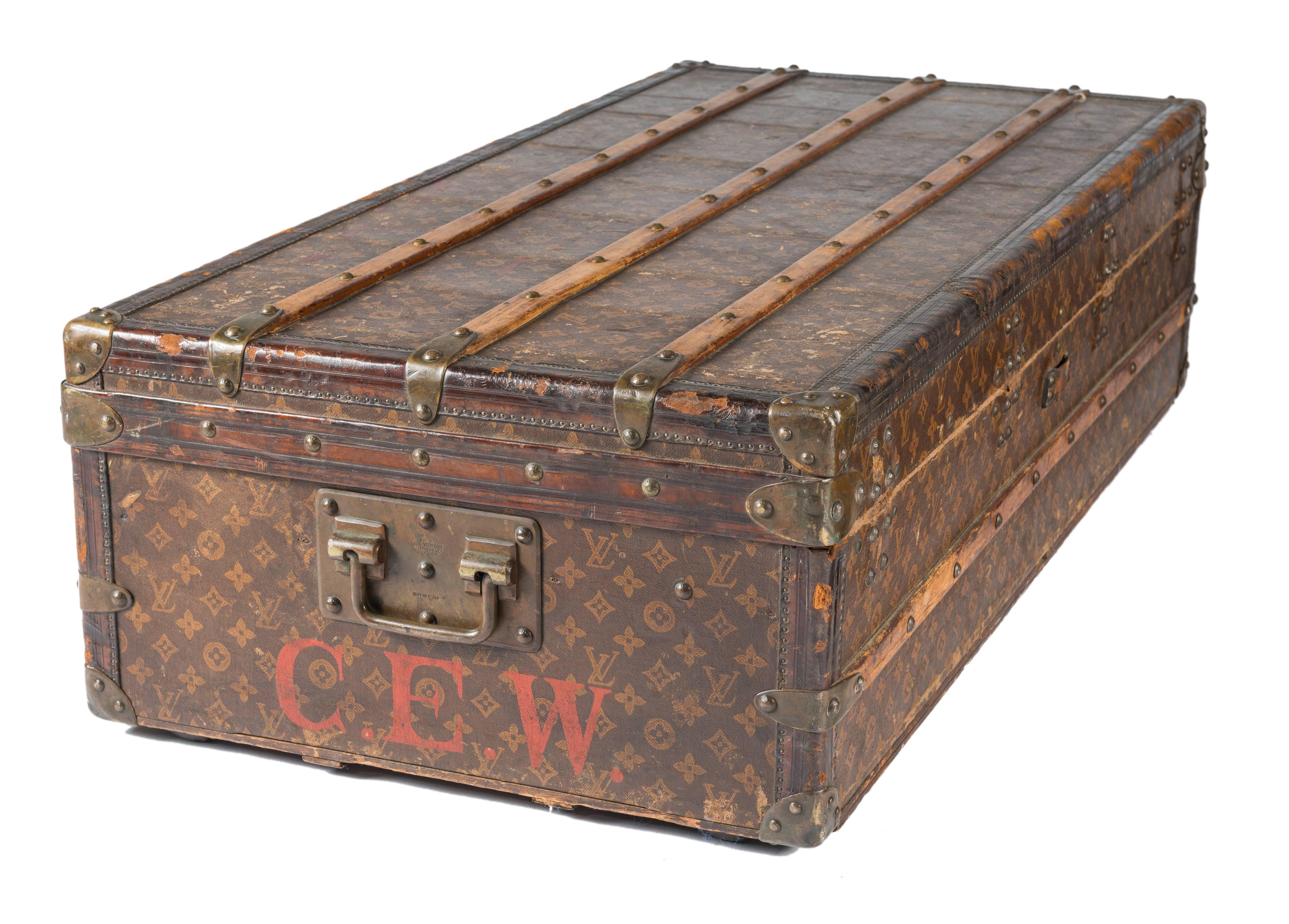Louis Vuitton flat steamer trunk in good condition. Exterior is very intact with minimal sticker residues. Stenciled initials on the sides. Retailed by John Wanamaker’s Labels and serial number intact. Has provenance.
 