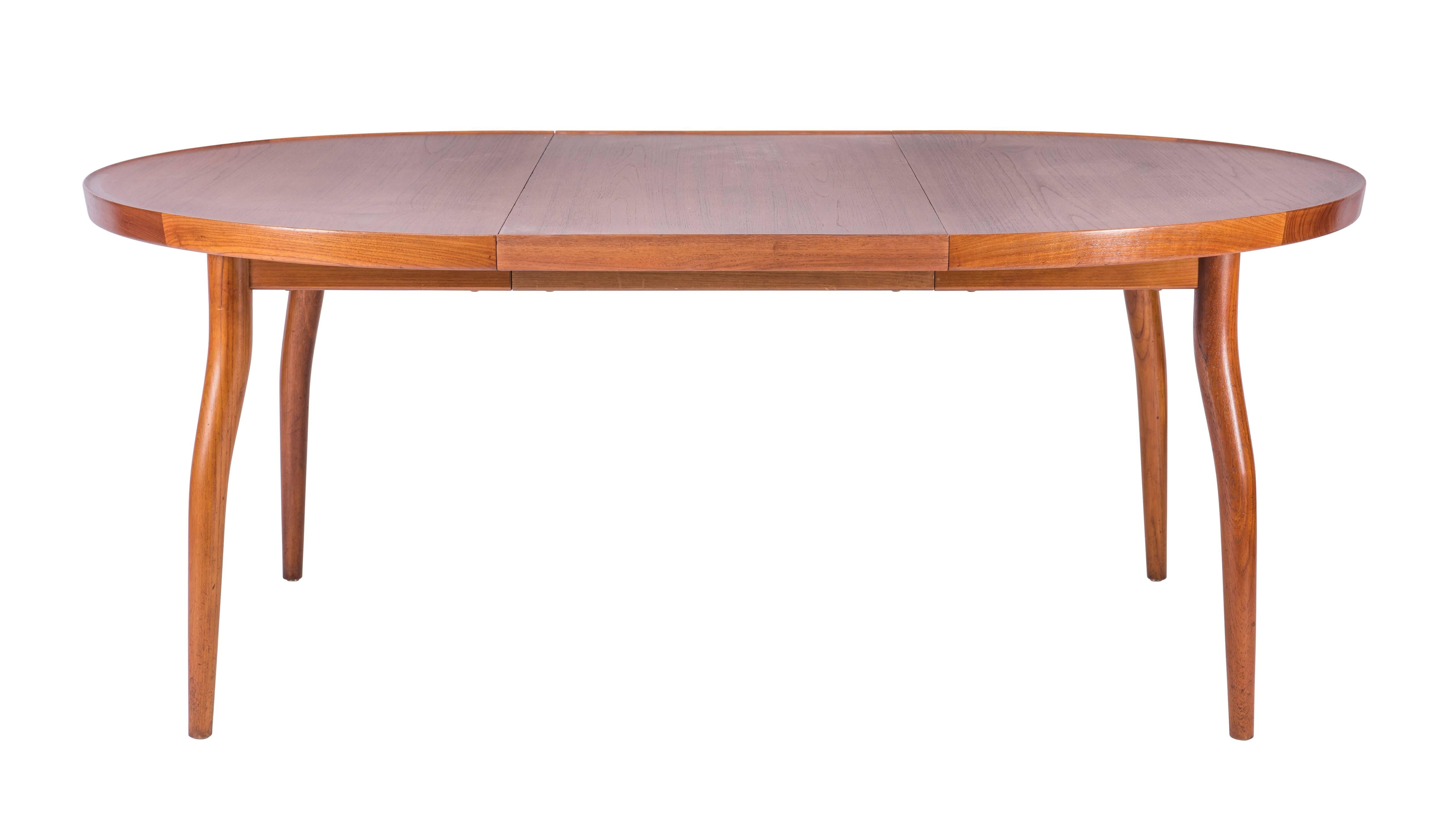 Finn Juhl NV56 extendable dining table with two leaves in teak, designed in 1956. Executed by master cabinetmaker Niels Vodder of Copenhagen, Denmark. Underside branded 'Niels Vodder Cabinetmaker Copenhagen, Denmark.'