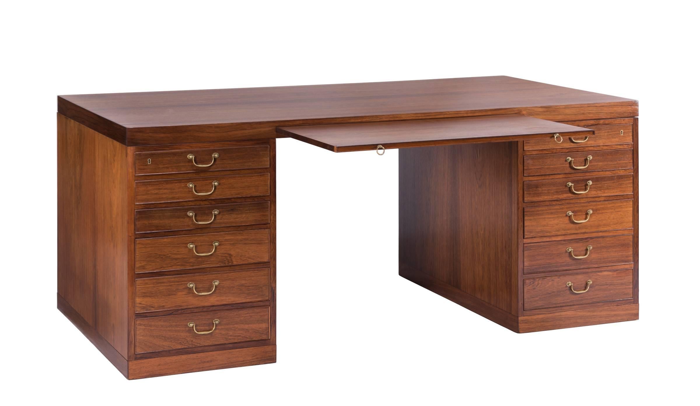 Rare and important partners desk designed by Danish designer Ole Wanscher and hand crafted in Copenhagen by master cabinet maker A.J. Iversen, circa 1943.

The desk is beautifully constructed from oak with very fine and extremely rare Brazilian