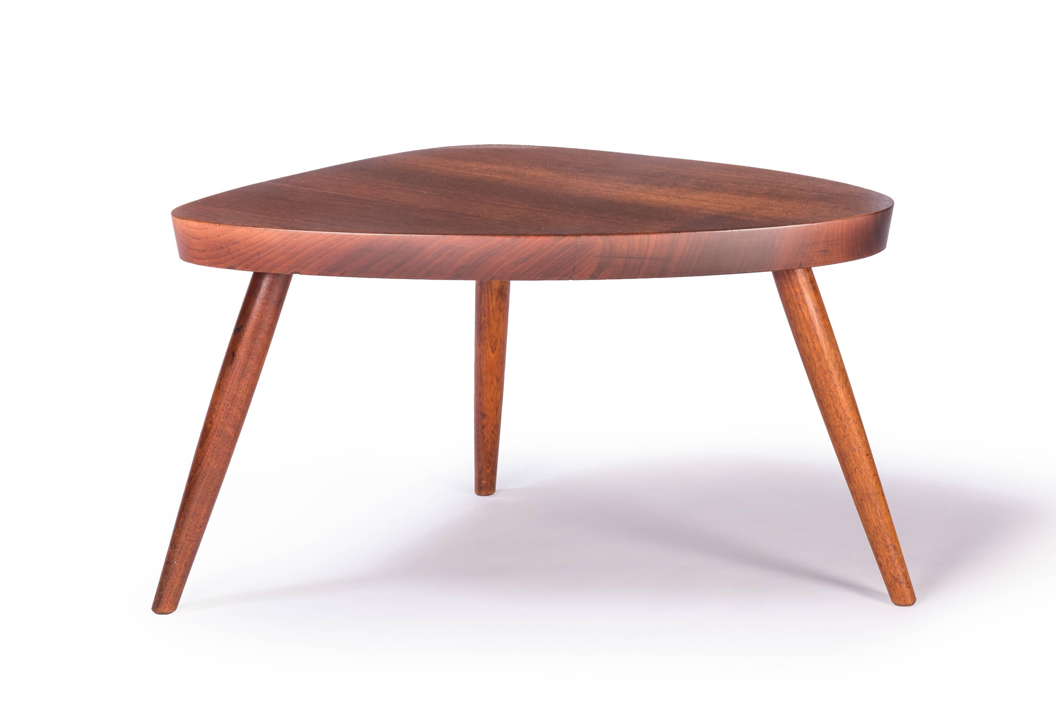 Nakashima Wepman side table with tapered legs and thick slab top in American Walnut by the leading American Studio Craft designer George Nakashima.