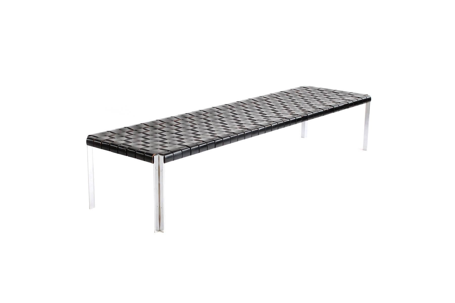 Magnificent bench with woven black leather belts on a matte chromium-plated steel base designed by Estelle and Erwine Laverne. Manufactured by Laverne International, circa 1955. A rarely seen design from Laverne. Bench in very good condition with a
