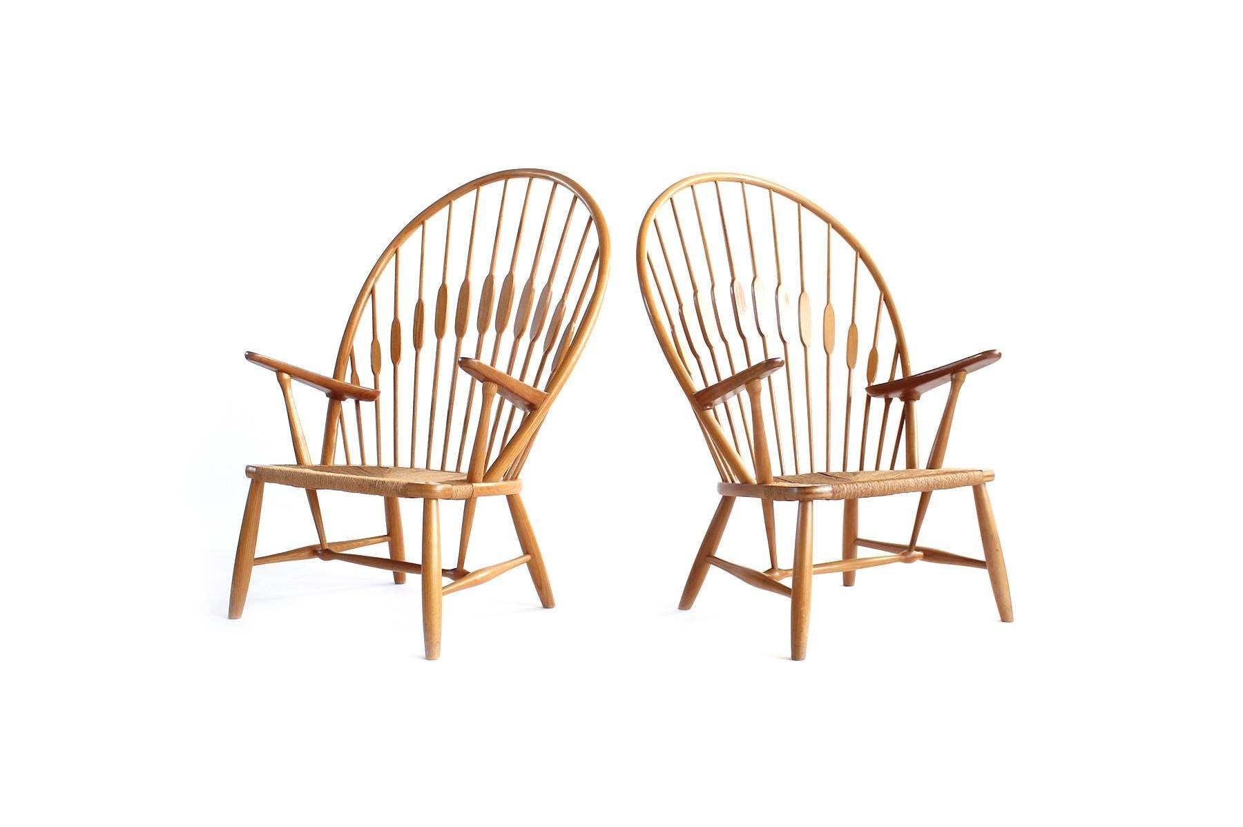  Pair of oak and teak Hans Wegner Peacock Chairs for Johannes Hansen. Both signed and in excellent condition.