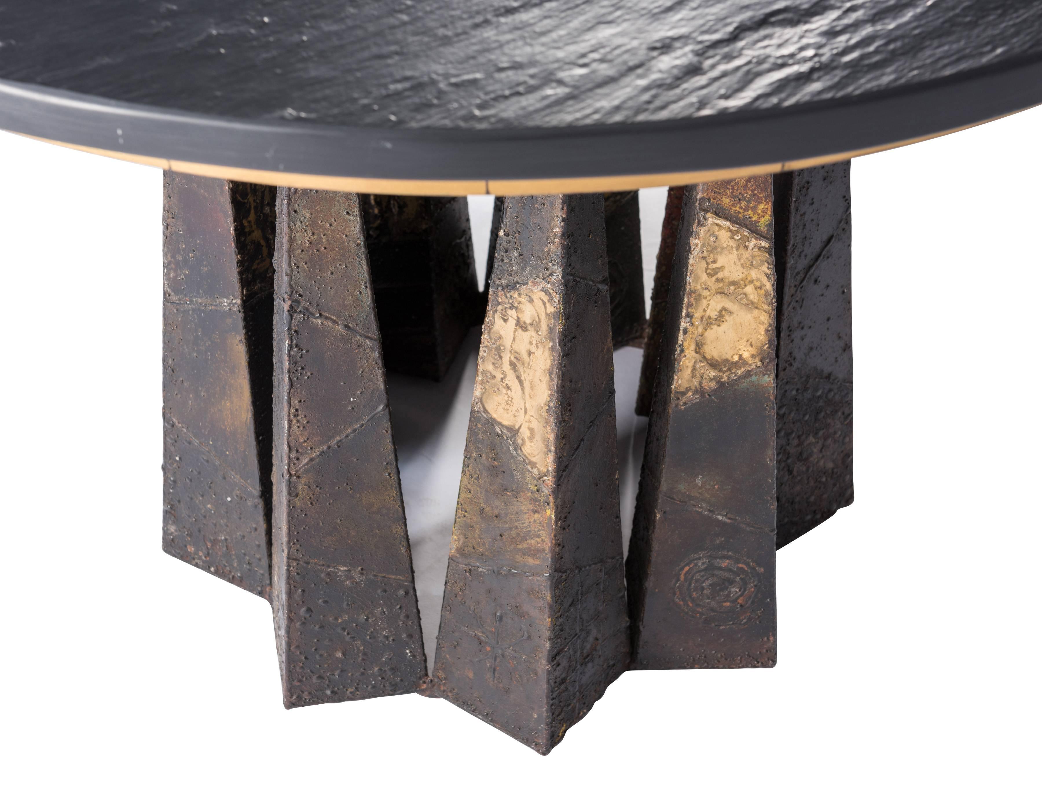 Welded and patinated steel dining table with replaced slate top designed by Paul Evans Signed and dated P.E. 74.