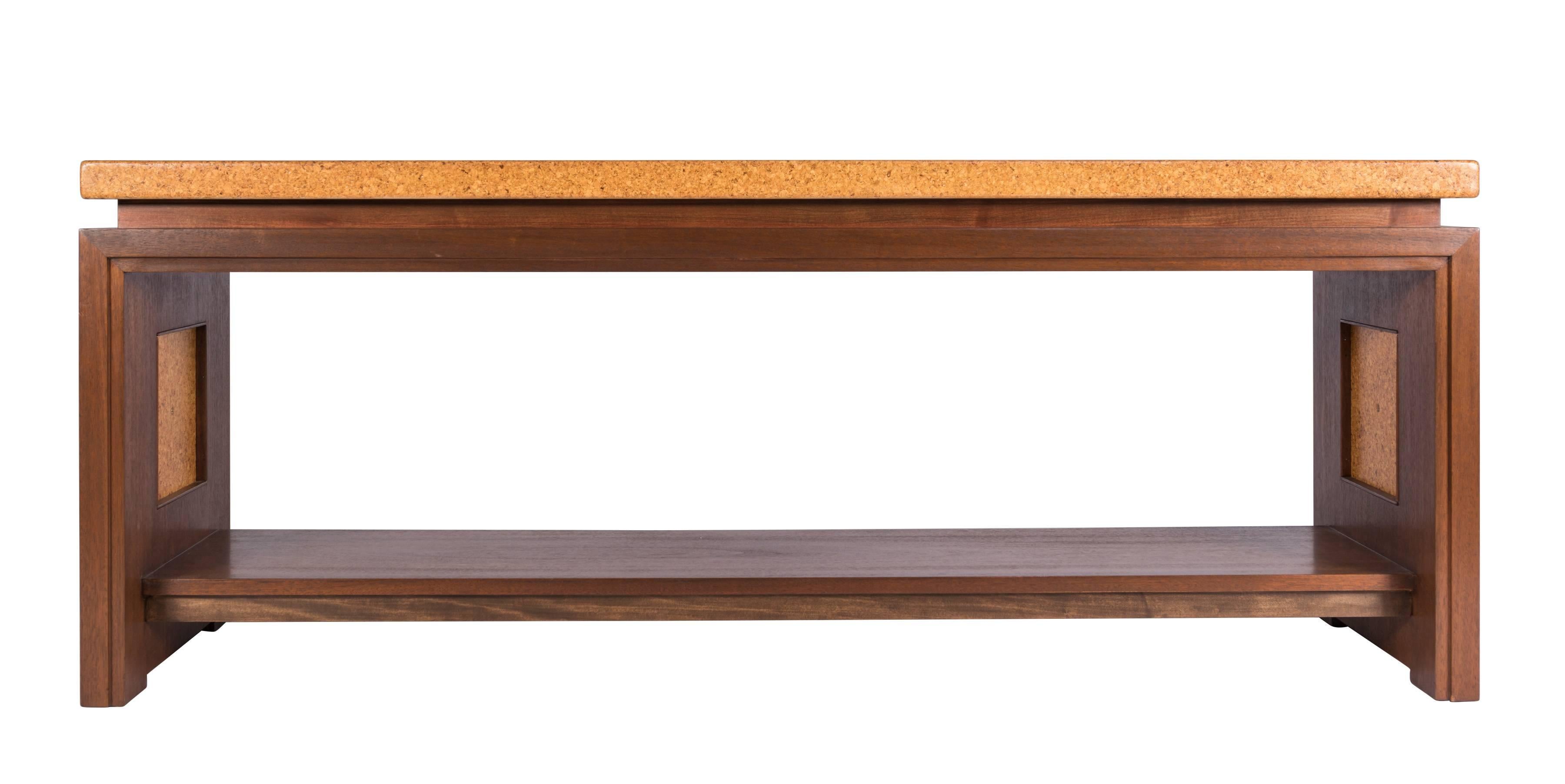 Rare console table designed by Paul Frankl for Johnson Furniture Company, circa 1948. Features a rectangular cork top over a mahogany base with cork and brass trim at each end. Model 5034.