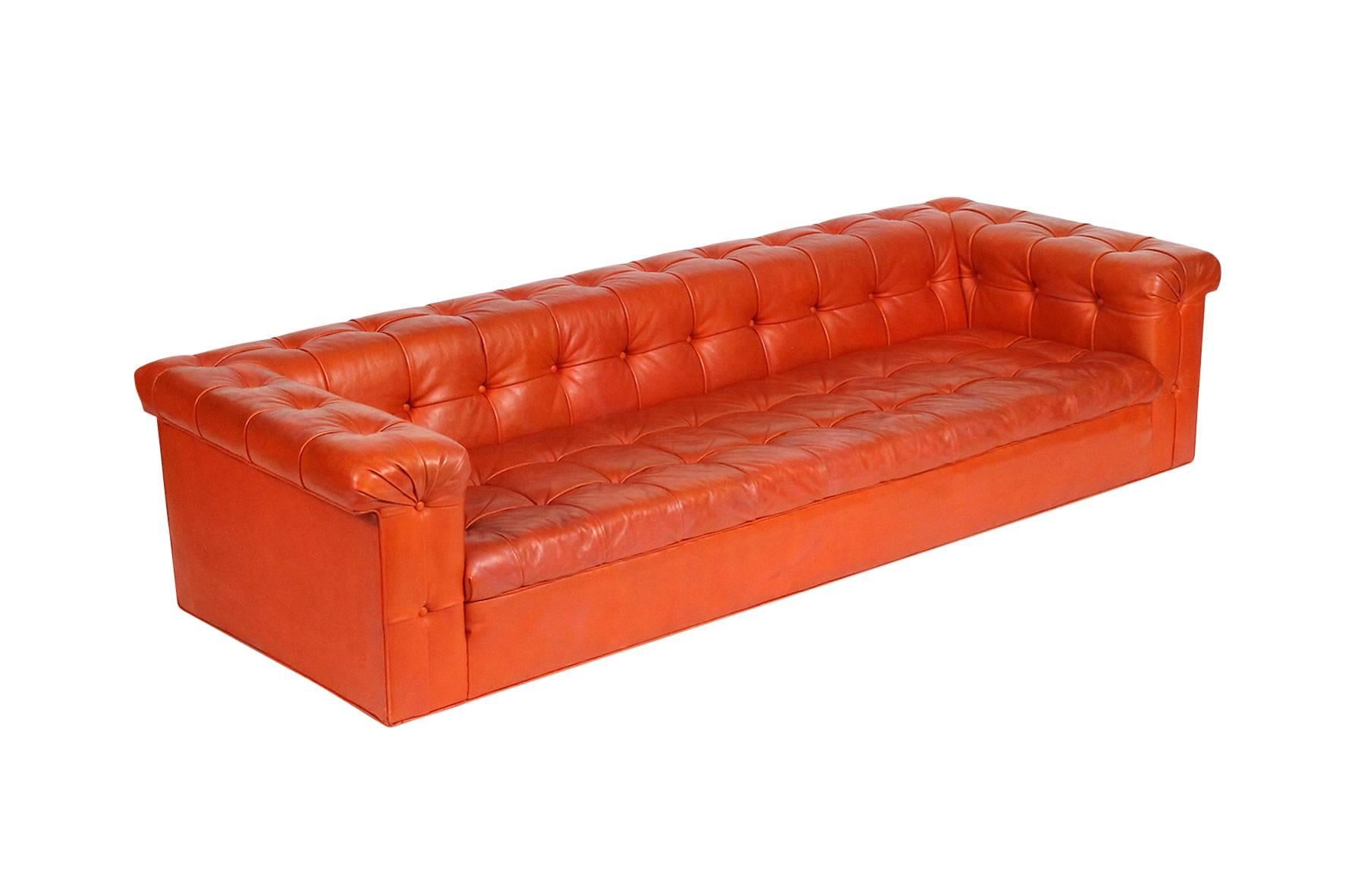 Rare Dunbar party sofa by Edward Wormley in original orange-brown leather.