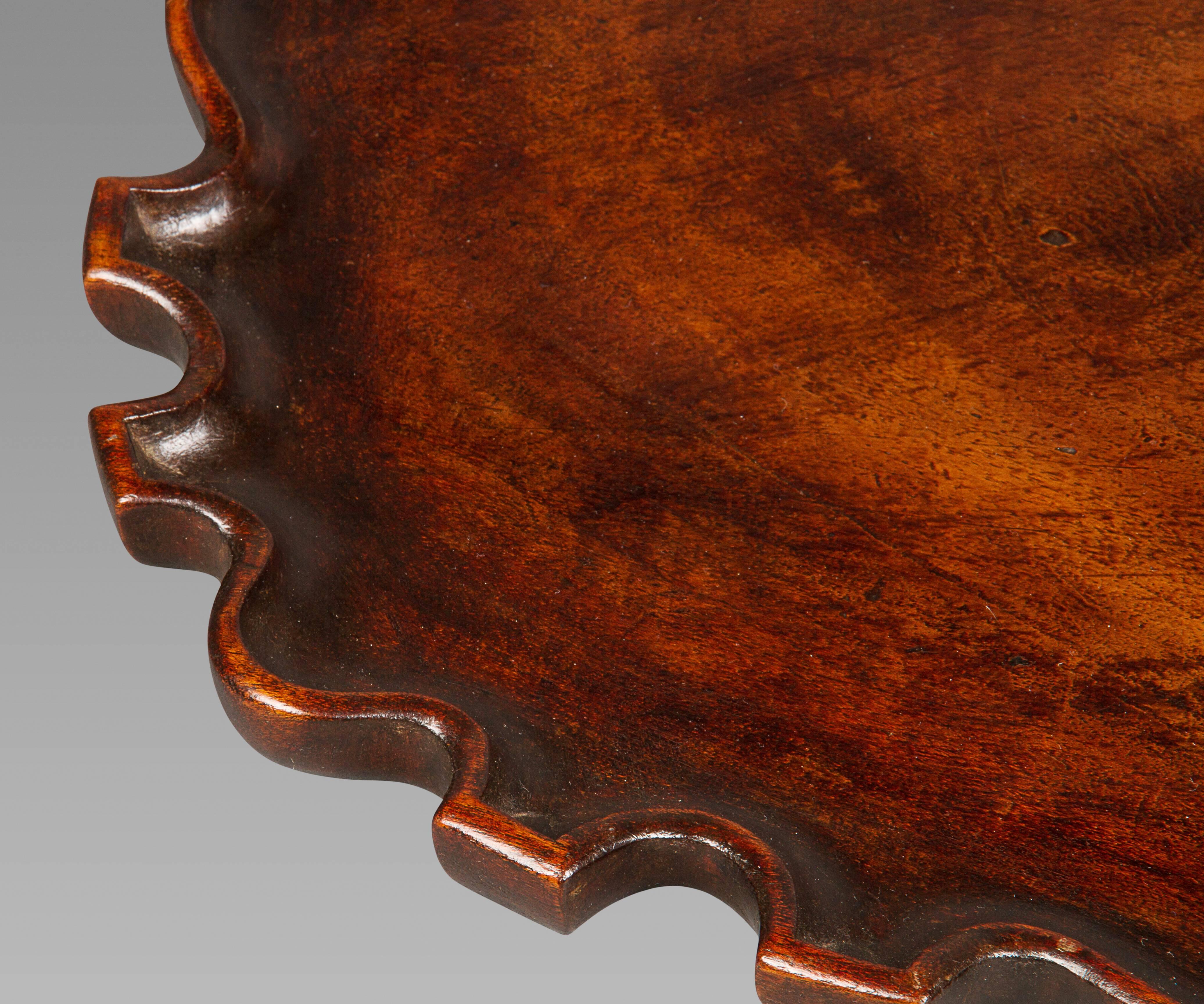 A very fine tray in dense mahogany with deep rich color and patina. This piece has an attractive outline and can be considered rare.