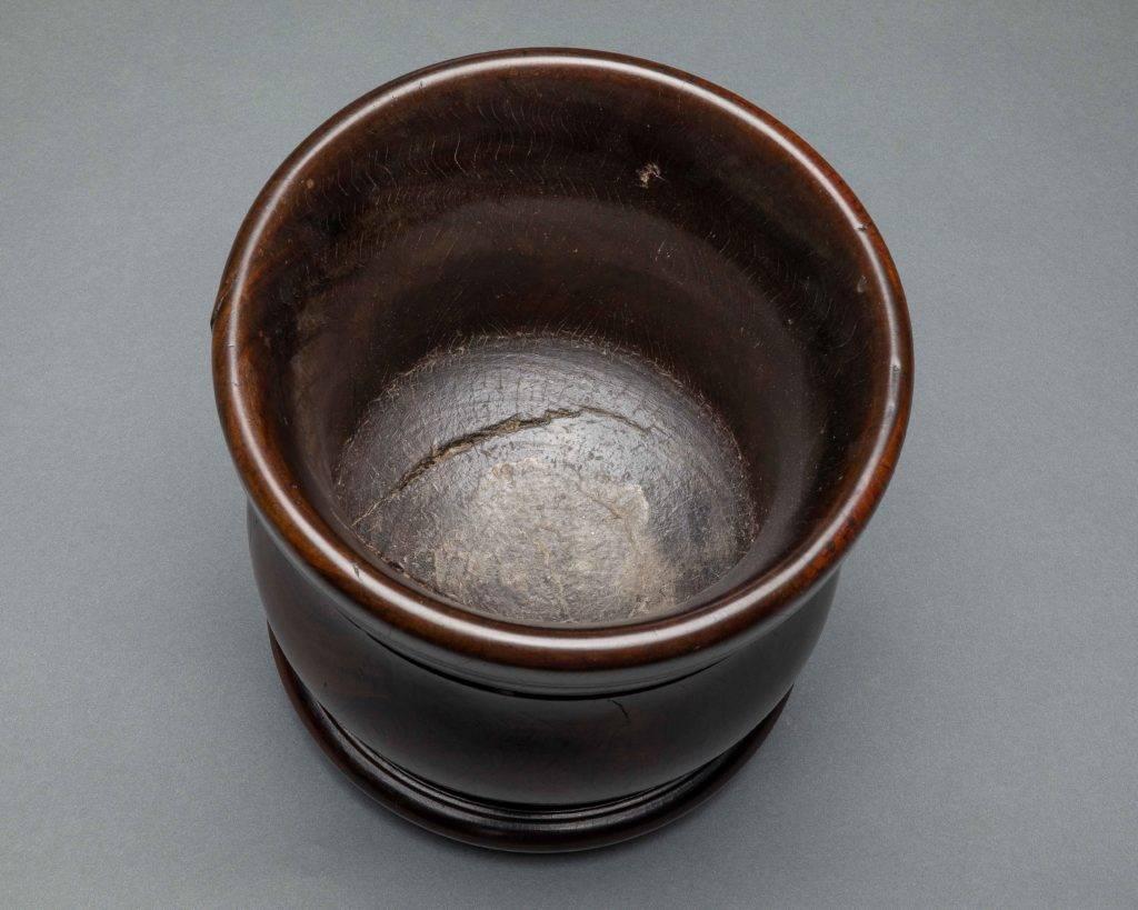 This turned lignum mortar is particularly large and has retained a superb color and pagination. Stamped three times “F WEST.”

English, circa 1690.